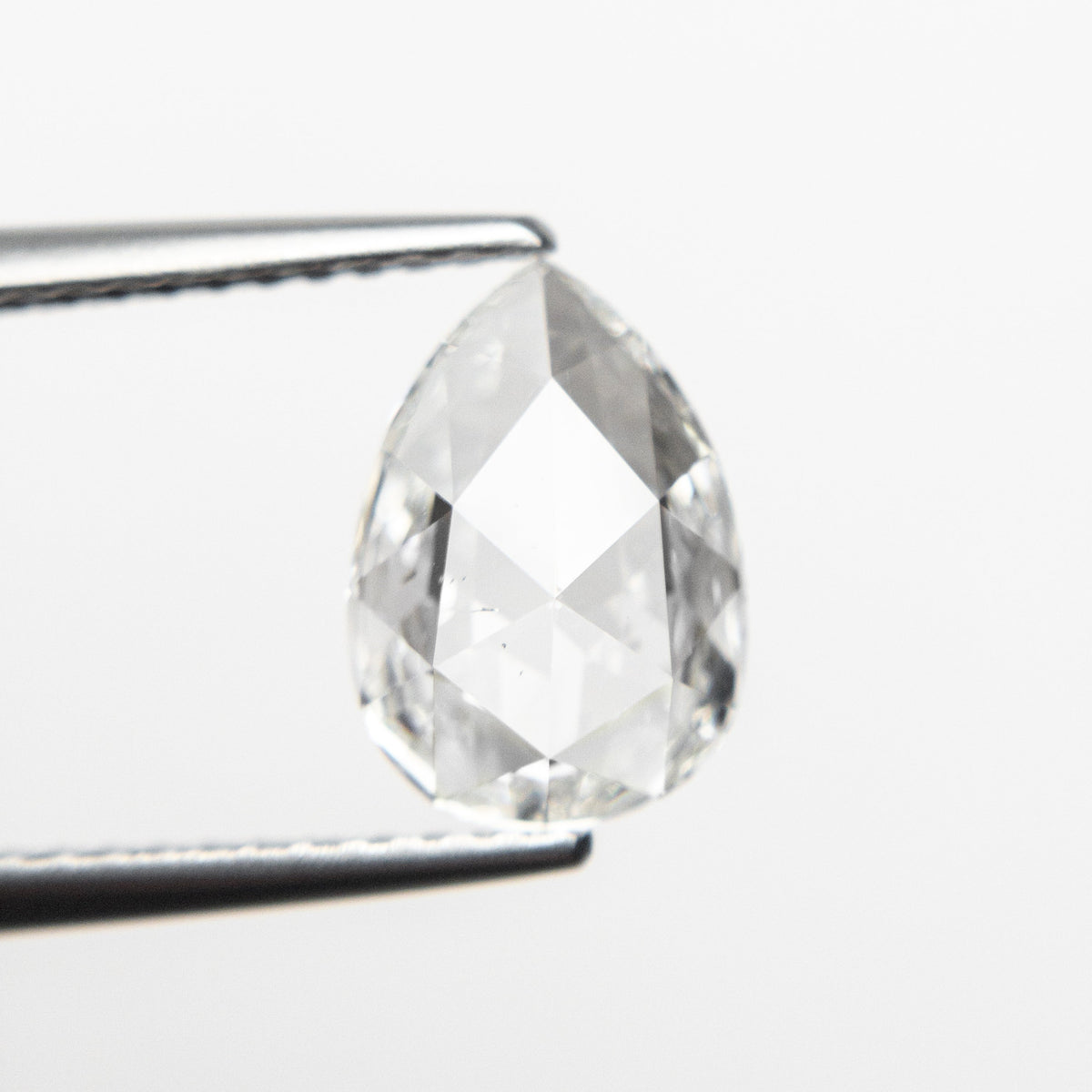 The 1.29ct 9.63x6.73x2.74mm SI1 G Pear Rosecut 19643-01 by East London jeweller Rachel Boston | Discover our collections of unique and timeless engagement rings, wedding rings, and modern fine jewellery.