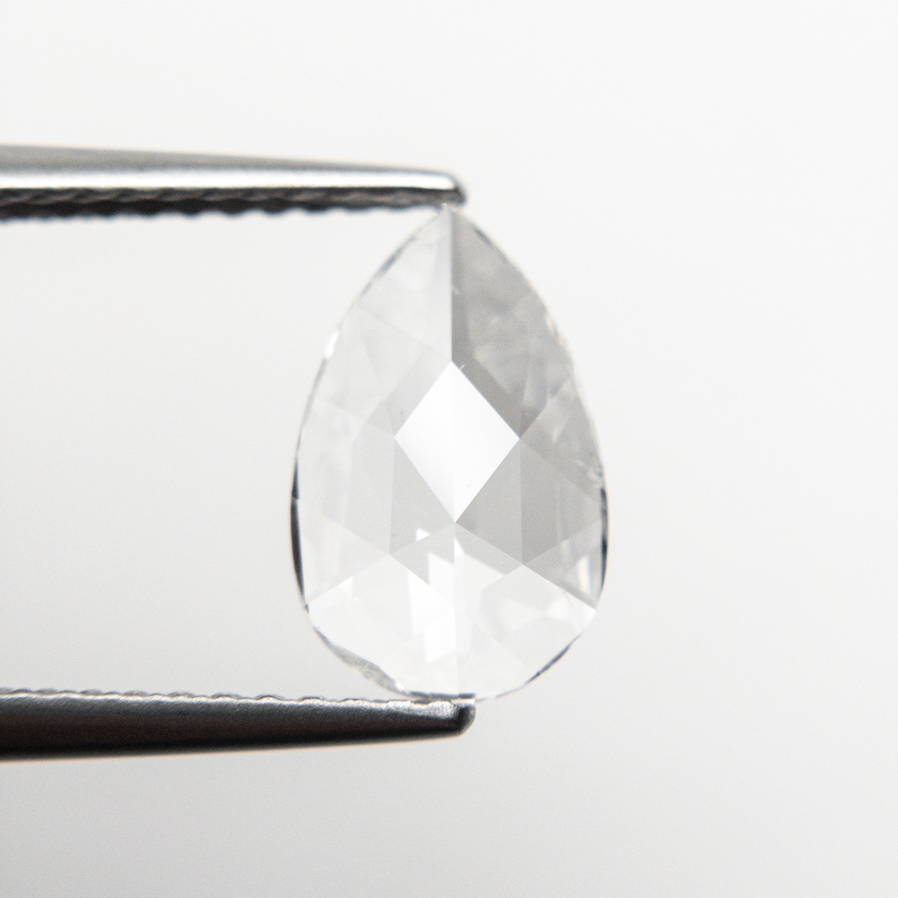 The 1.00ct 10.33x6.44x1.98mm SI2 E Pear Rosecut 19645-01 by East London jeweller Rachel Boston | Discover our collections of unique and timeless engagement rings, wedding rings, and modern fine jewellery.