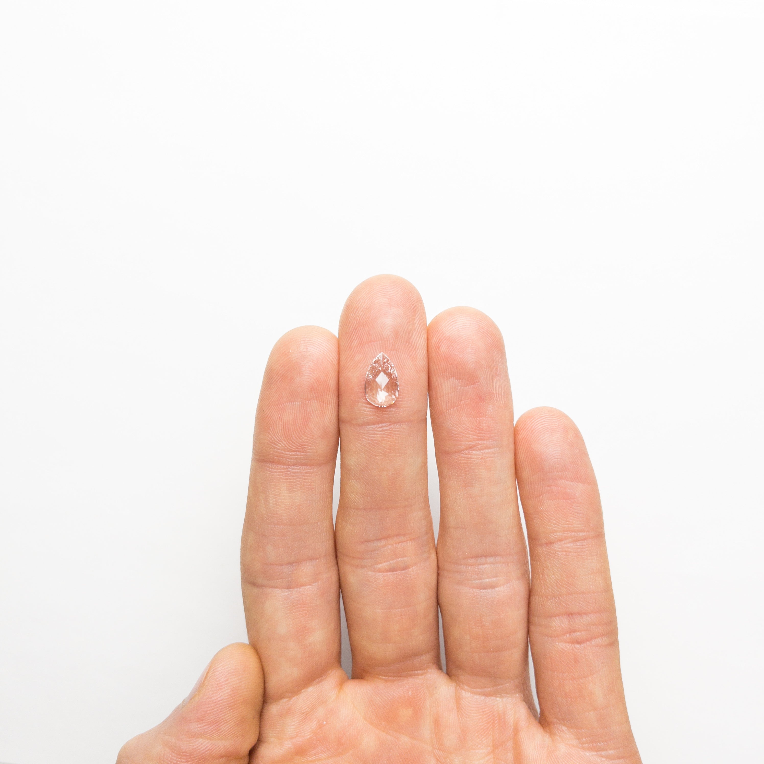 The 1.00ct 10.33x6.44x1.98mm SI2 E Pear Rosecut 19645-01 by East London jeweller Rachel Boston | Discover our collections of unique and timeless engagement rings, wedding rings, and modern fine jewellery.