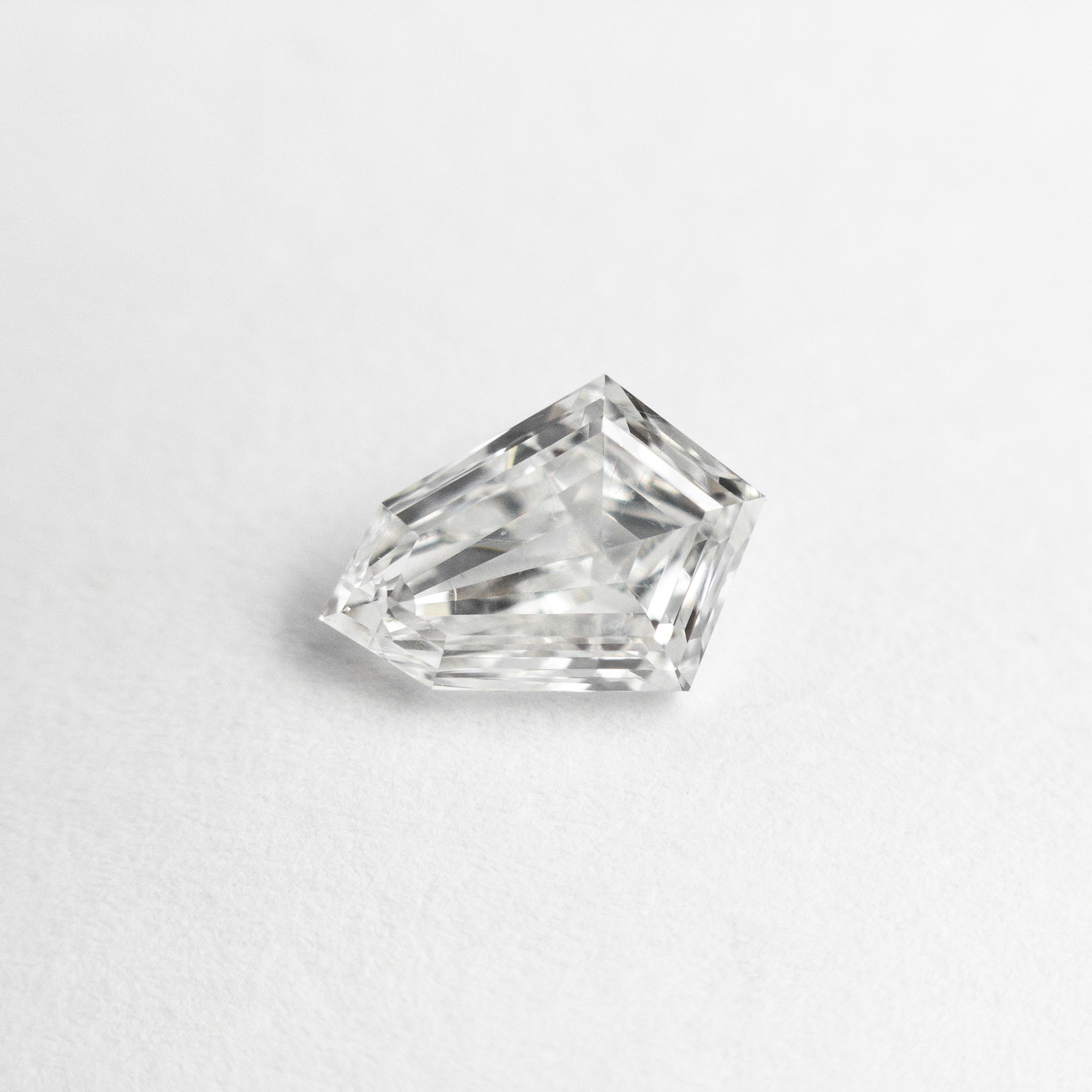 The 0.81ct 7.96x5.64x2.69mm SI1 F Kite Step Cut 19649-01 by East London jeweller Rachel Boston | Discover our collections of unique and timeless engagement rings, wedding rings, and modern fine jewellery.