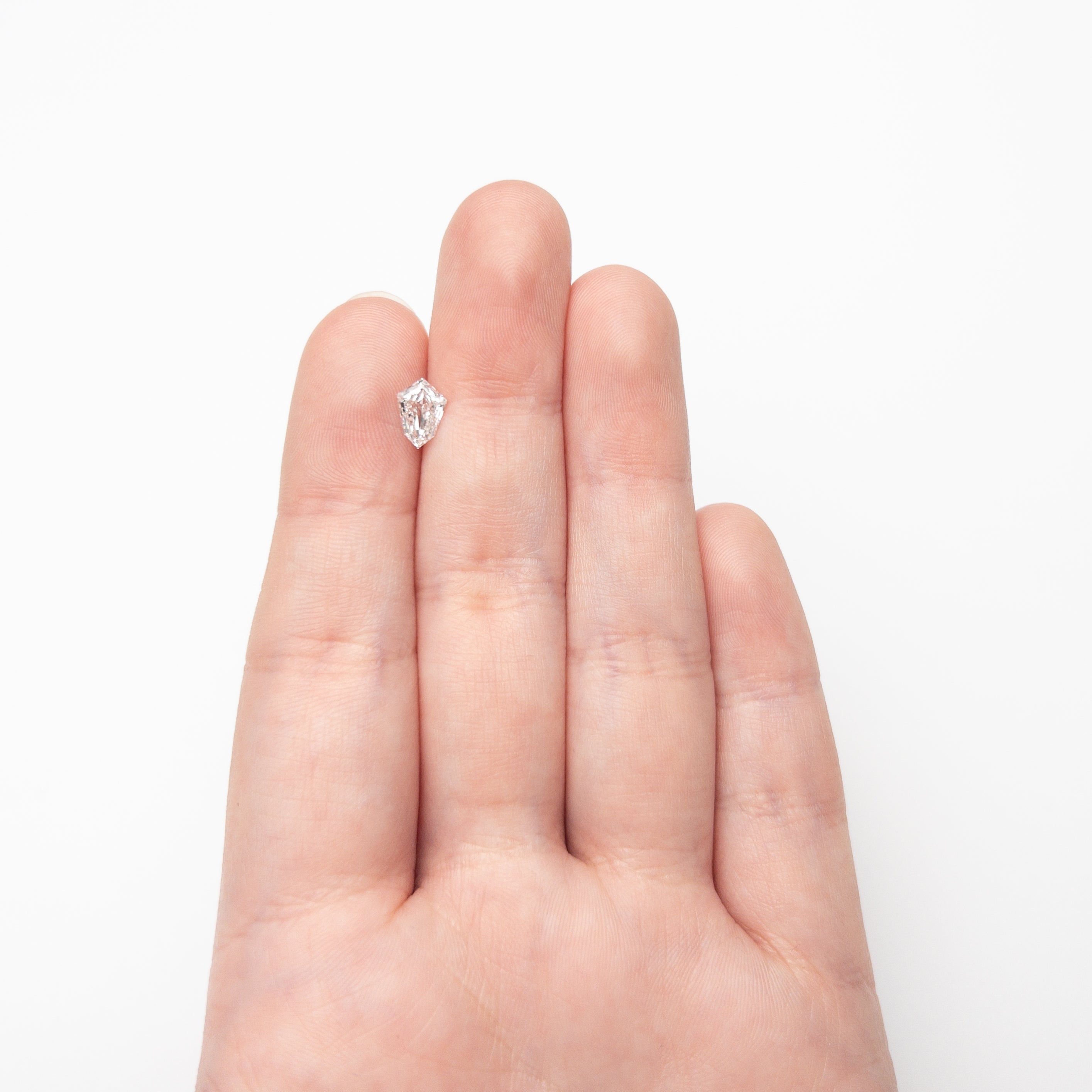 The 0.81ct 7.96x5.64x2.69mm SI1 F Kite Step Cut 19649-01 by East London jeweller Rachel Boston | Discover our collections of unique and timeless engagement rings, wedding rings, and modern fine jewellery.