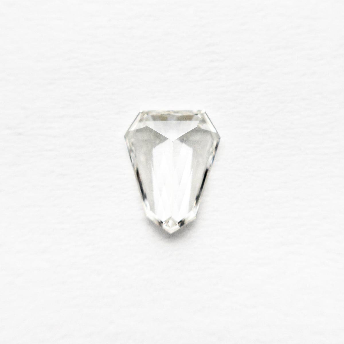 The 0.43ct 6.63x5.17x1.84mm VVS G Shield Step Cut 19655-01 by East London jeweller Rachel Boston | Discover our collections of unique and timeless engagement rings, wedding rings, and modern fine jewellery.