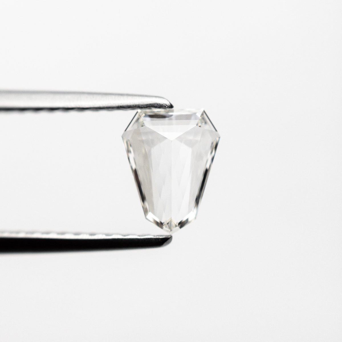 The 0.43ct 6.63x5.17x1.84mm VVS G Shield Step Cut 19655-01 by East London jeweller Rachel Boston | Discover our collections of unique and timeless engagement rings, wedding rings, and modern fine jewellery.