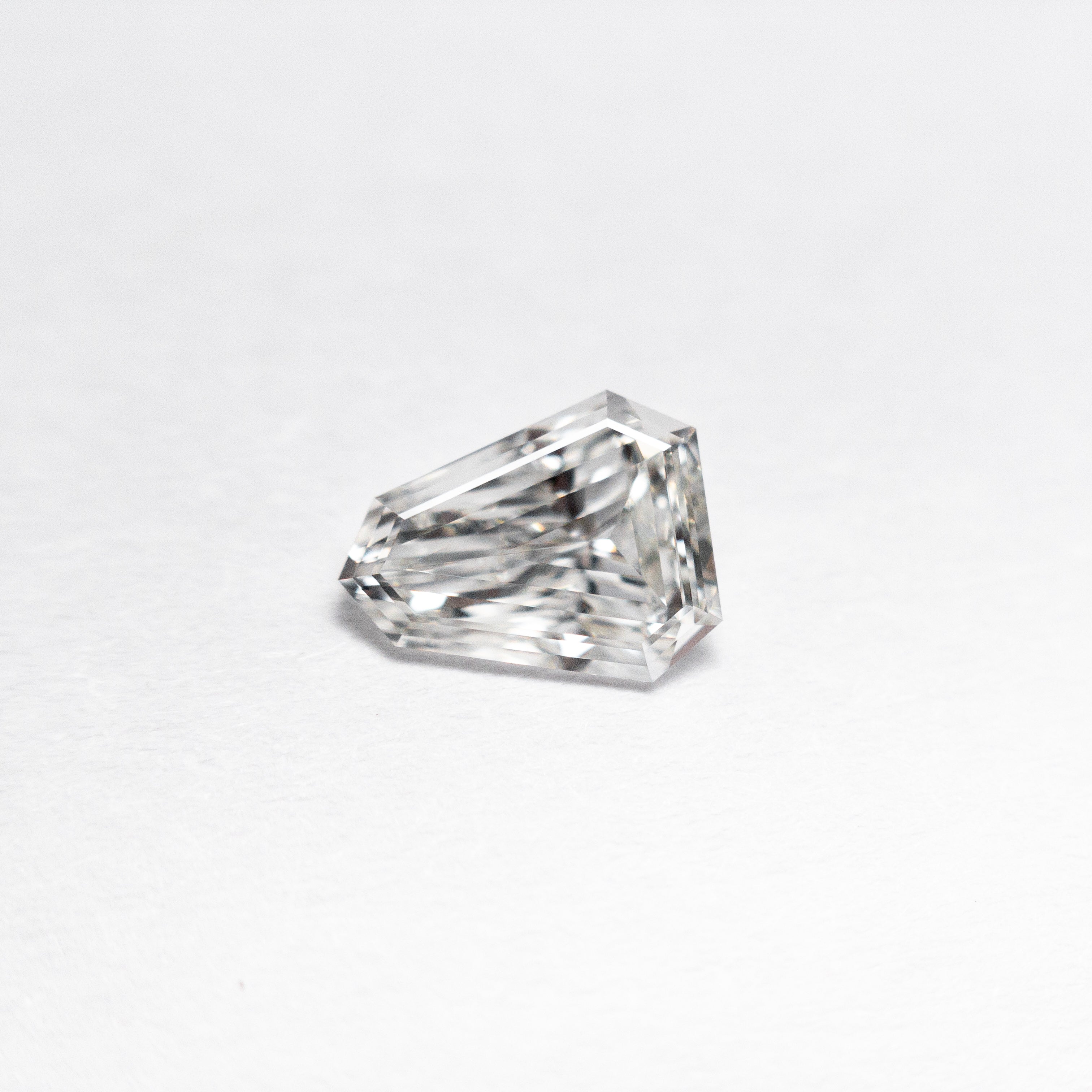 The 0.43ct 6.63x5.17x1.84mm VVS G Shield Step Cut 19655-01 by East London jeweller Rachel Boston | Discover our collections of unique and timeless engagement rings, wedding rings, and modern fine jewellery.
