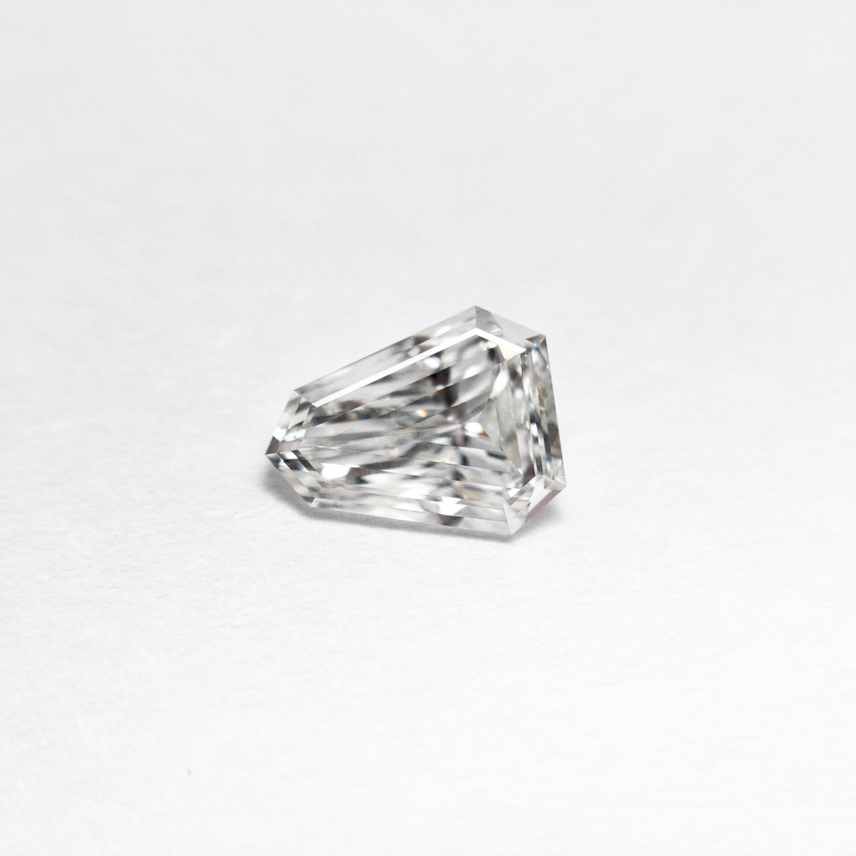 The 0.43ct 6.63x5.17x1.84mm VVS G Shield Step Cut 19655-01 by East London jeweller Rachel Boston | Discover our collections of unique and timeless engagement rings, wedding rings, and modern fine jewellery.