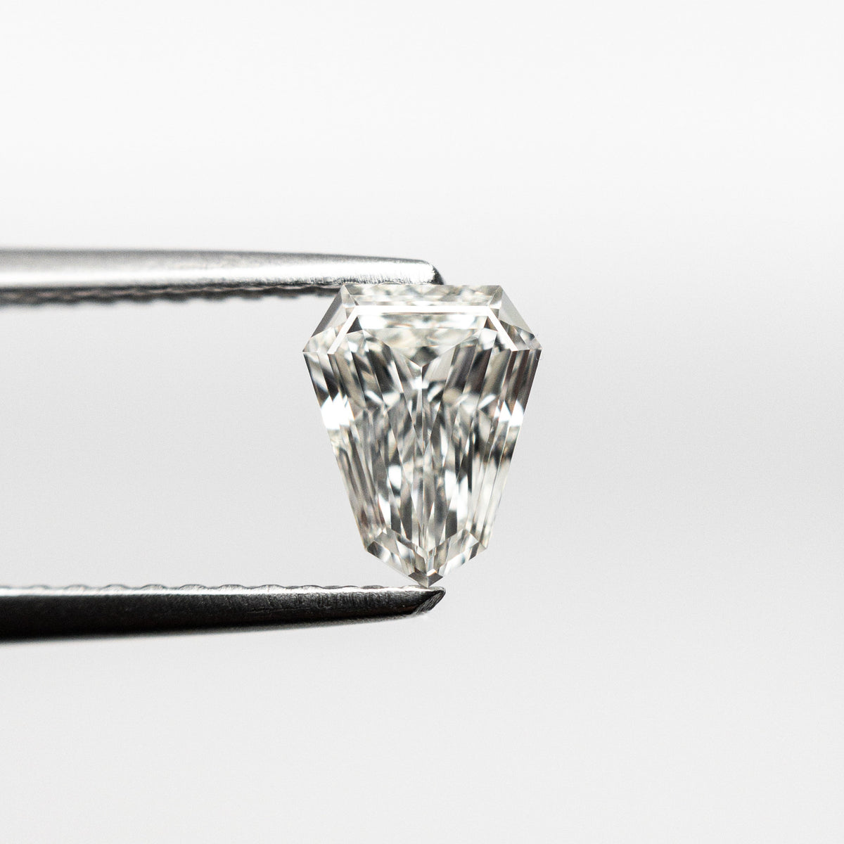 The 0.43ct 6.63x5.17x1.84mm VVS G Shield Step Cut 19655-01 by East London jeweller Rachel Boston | Discover our collections of unique and timeless engagement rings, wedding rings, and modern fine jewellery.