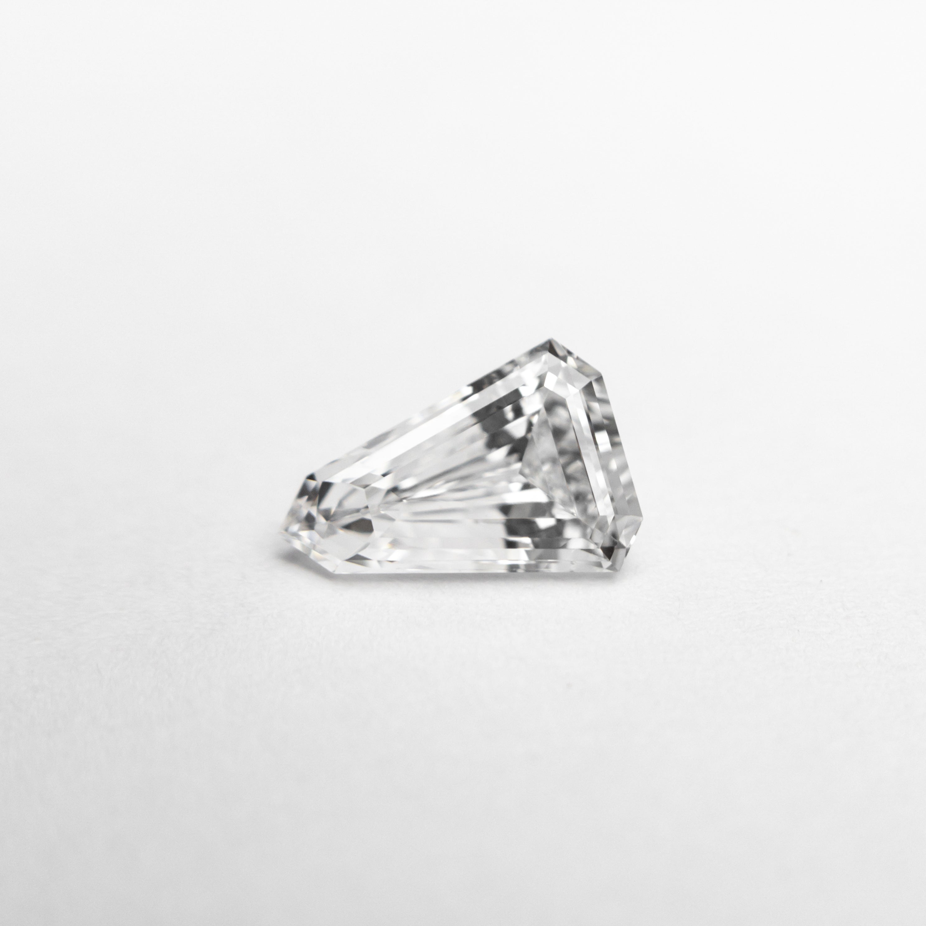 The 0.55ct 7.13x4.85x2.66mm VS2 F Shield Step Cut 19677-03 by East London jeweller Rachel Boston | Discover our collections of unique and timeless engagement rings, wedding rings, and modern fine jewellery.