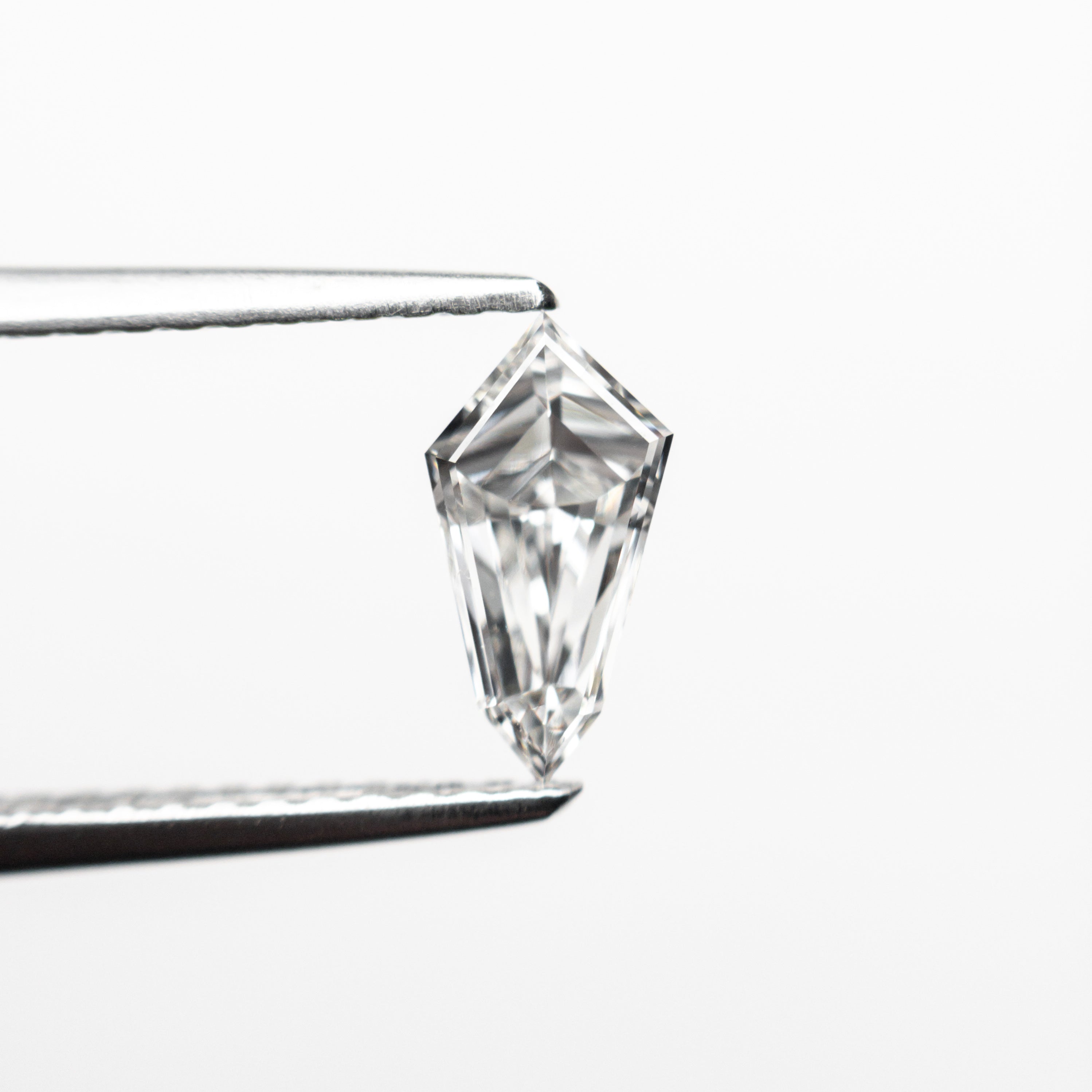 The 0.58ct 8.20x4.25x3.15mm VS2 F Kite Step Cut 19677-05 by East London jeweller Rachel Boston | Discover our collections of unique and timeless engagement rings, wedding rings, and modern fine jewellery.