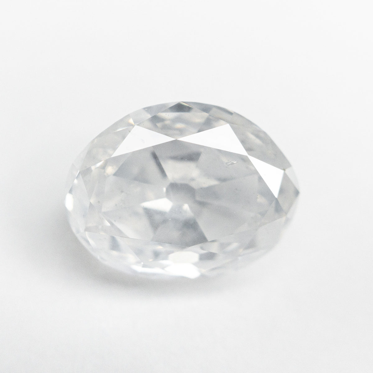 The 5.54ct 11.83x9.02x6.02mm GIA I2 Fancy White Modern Antique Oval Old Mine Cut 19722-01 by East London jeweller Rachel Boston | Discover our collections of unique and timeless engagement rings, wedding rings, and modern fine jewellery.