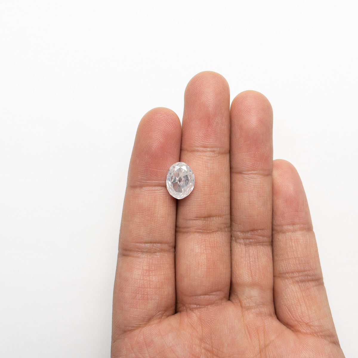 The 5.54ct 11.83x9.02x6.02mm GIA I2 Fancy White Modern Antique Oval Old Mine Cut 19722-01 by East London jeweller Rachel Boston | Discover our collections of unique and timeless engagement rings, wedding rings, and modern fine jewellery.