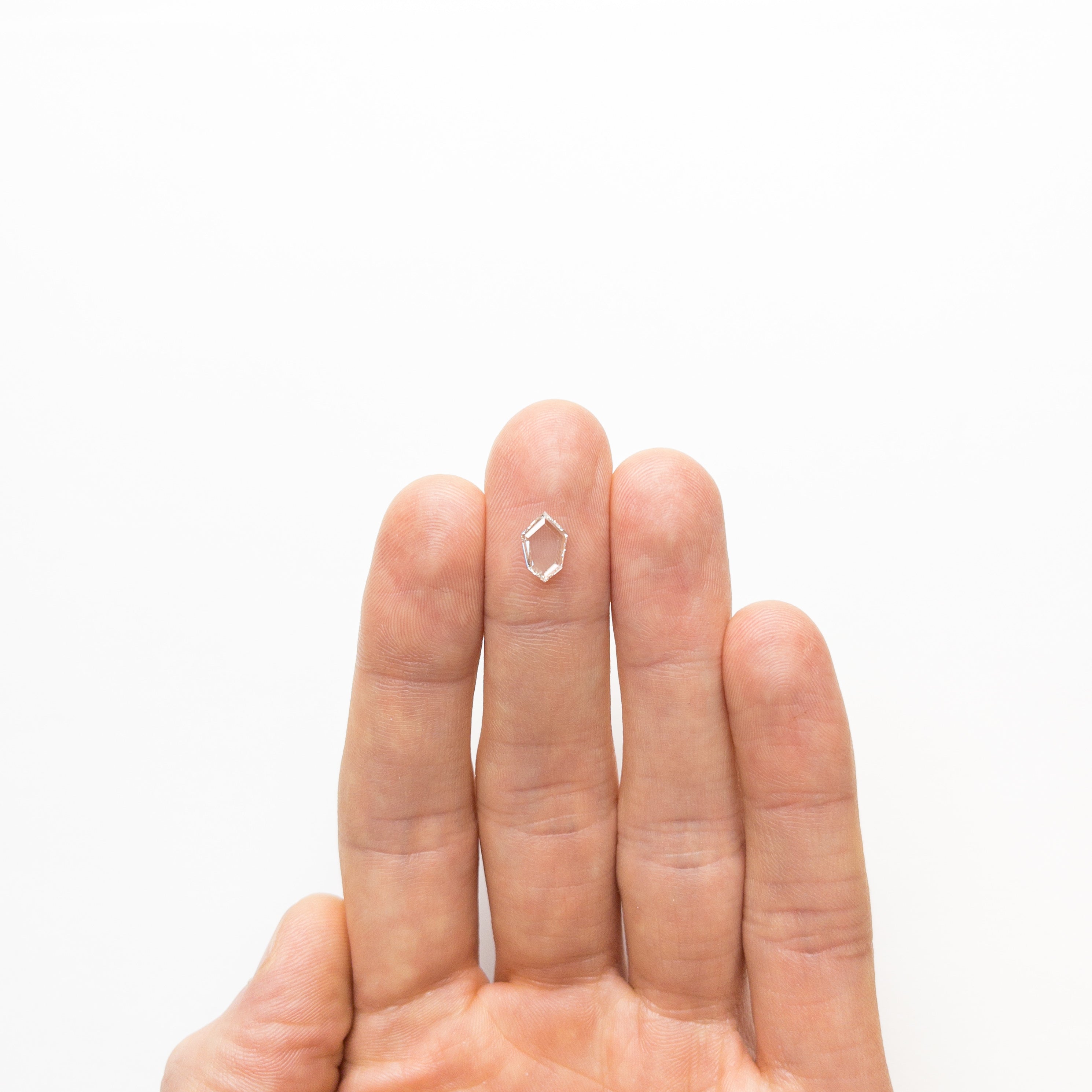 The 0.76ct 9.10x6.01x1.59mm VS2 G Kite Portrait Cut 19854-13 by East London jeweller Rachel Boston | Discover our collections of unique and timeless engagement rings, wedding rings, and modern fine jewellery.