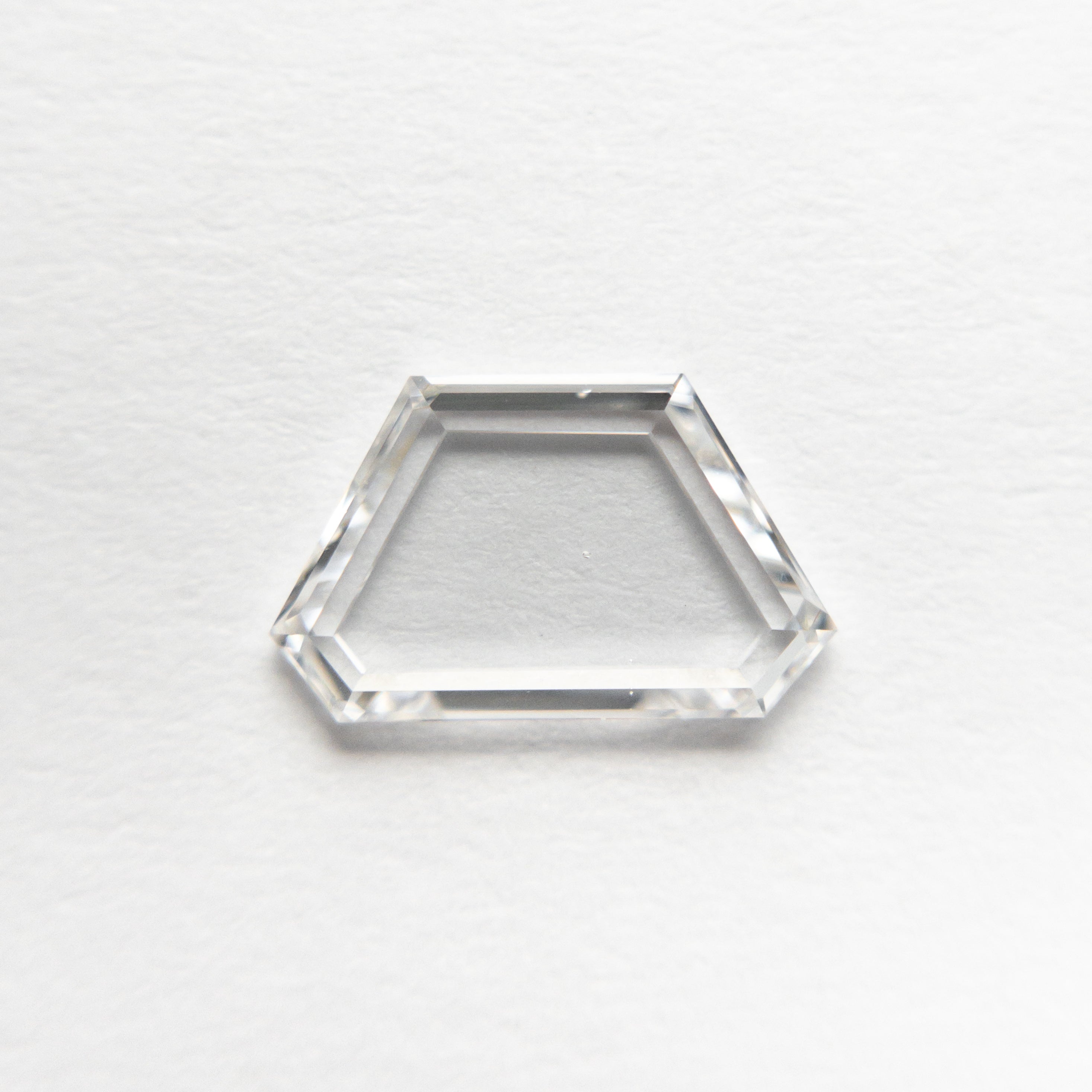 The 0.90ct 5.52x9.06x1.62mm VS2/SI1 E Geometric Portrait Cut 19854-19 by East London jeweller Rachel Boston | Discover our collections of unique and timeless engagement rings, wedding rings, and modern fine jewellery.