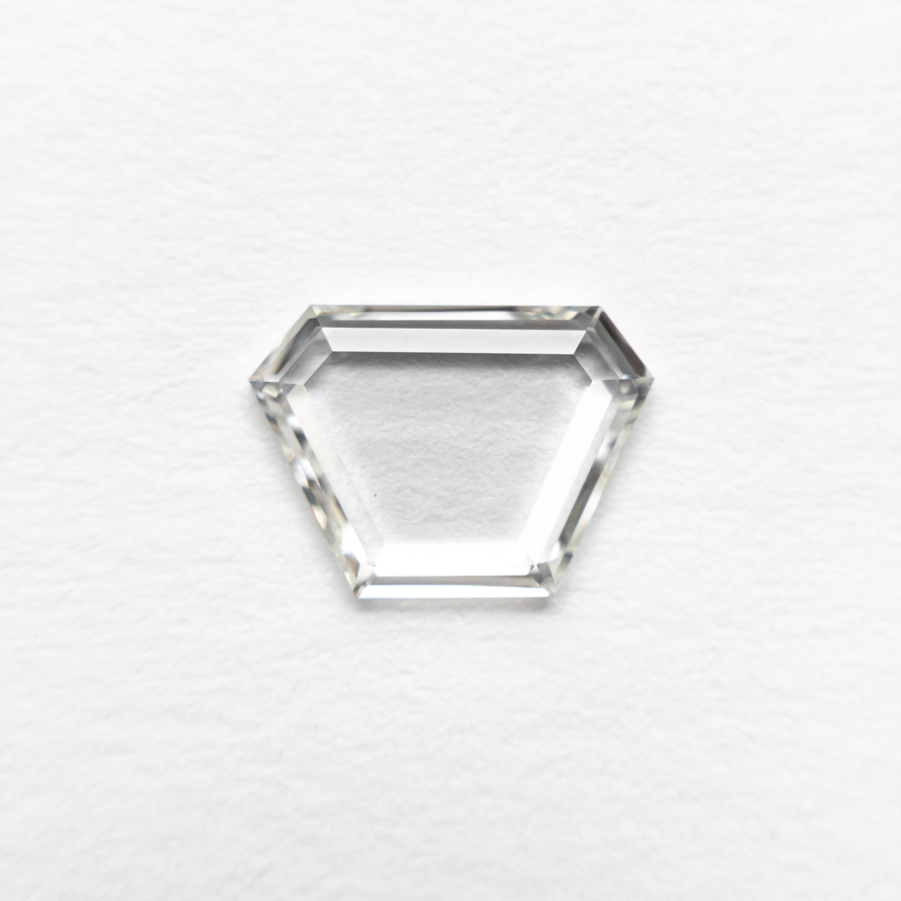 The 0.70ct 8.24x5.91x1.31mm VS1 I Trapezoid Portrait Cut 19854-24 by East London jeweller Rachel Boston | Discover our collections of unique and timeless engagement rings, wedding rings, and modern fine jewellery.