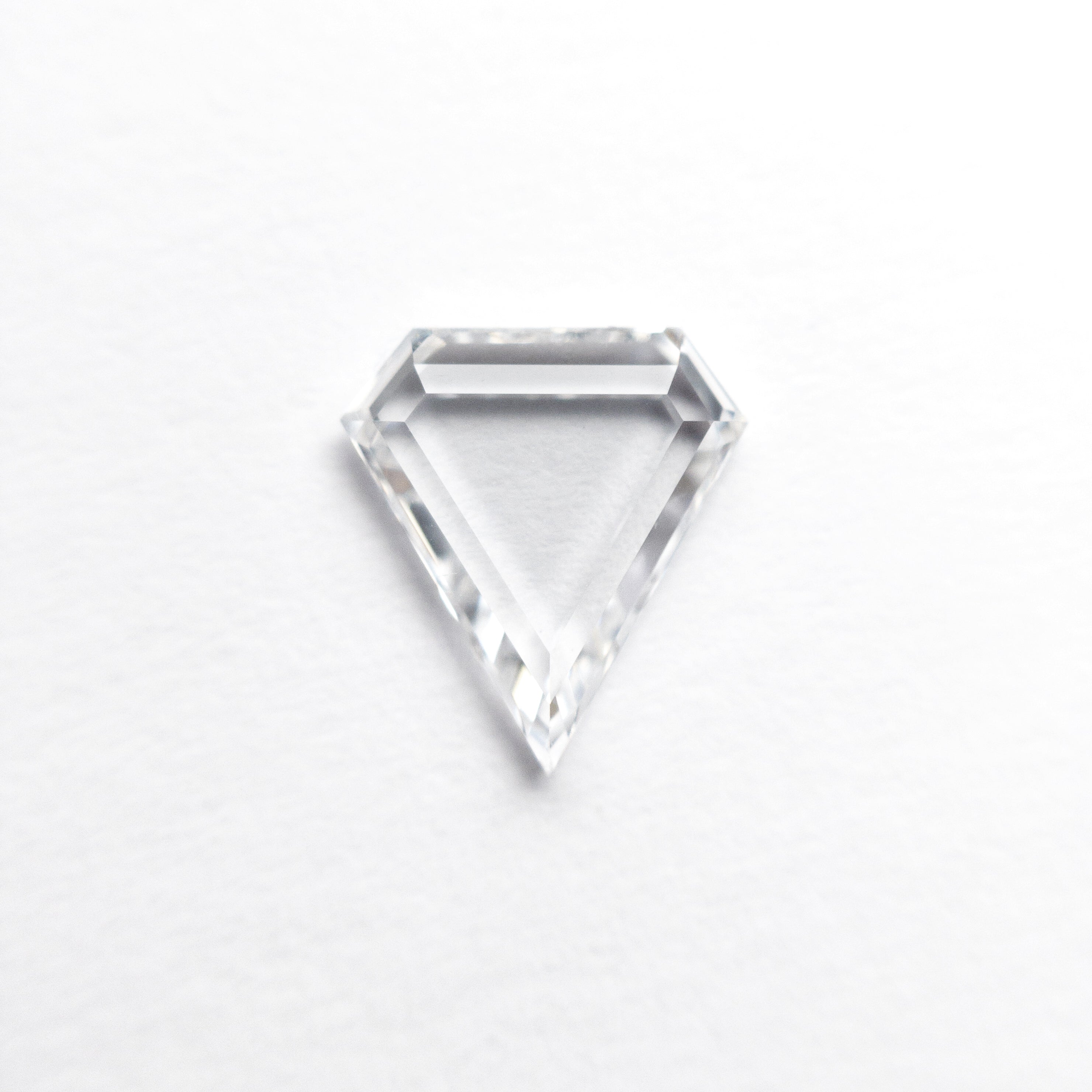 The 0.72ct 7.65x6.92x1.75mm VS2 D Shield Portrait Cut 19854-28 by East London jeweller Rachel Boston | Discover our collections of unique and timeless engagement rings, wedding rings, and modern fine jewellery.