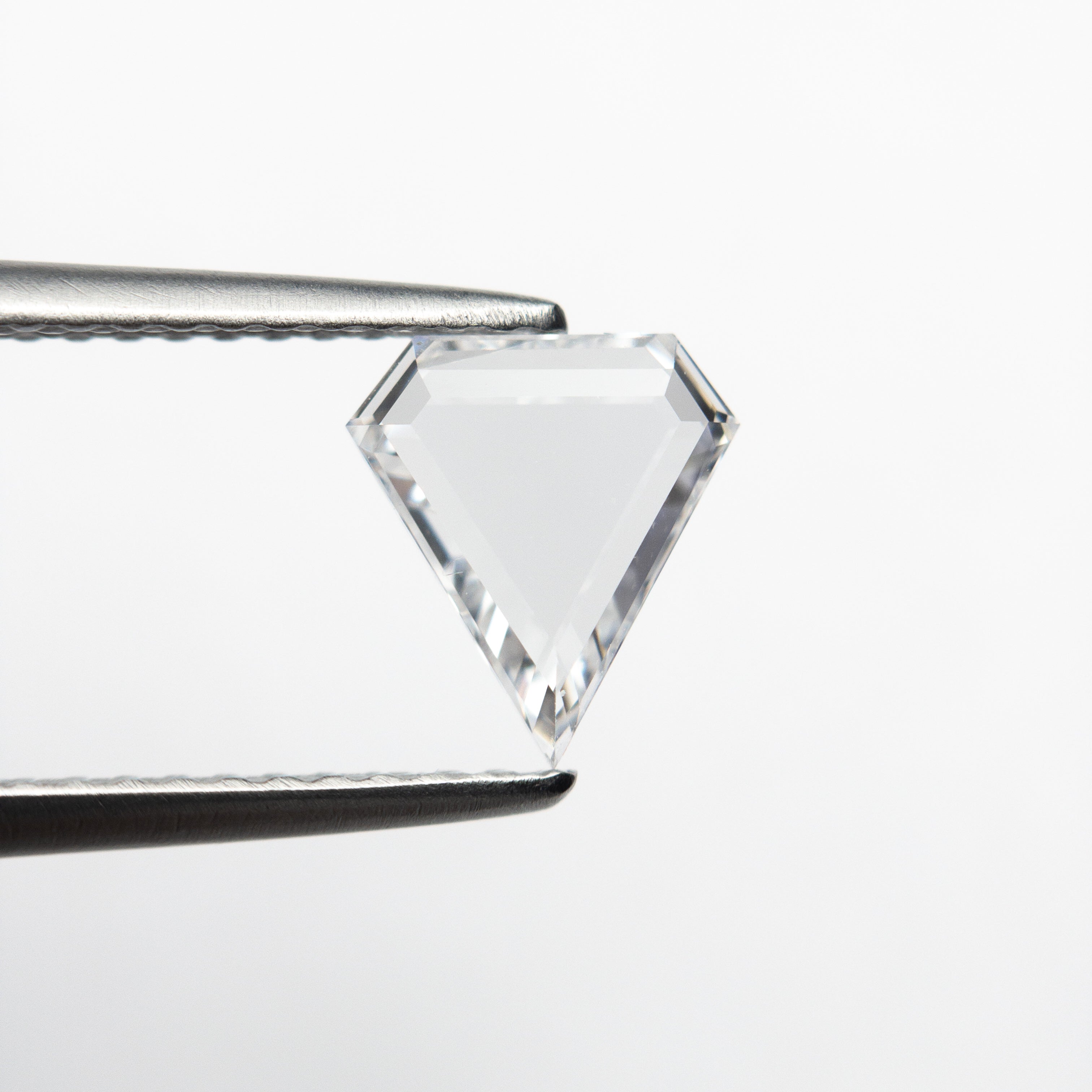 The 0.72ct 7.65x6.92x1.75mm VS2 D Shield Portrait Cut 19854-28 by East London jeweller Rachel Boston | Discover our collections of unique and timeless engagement rings, wedding rings, and modern fine jewellery.