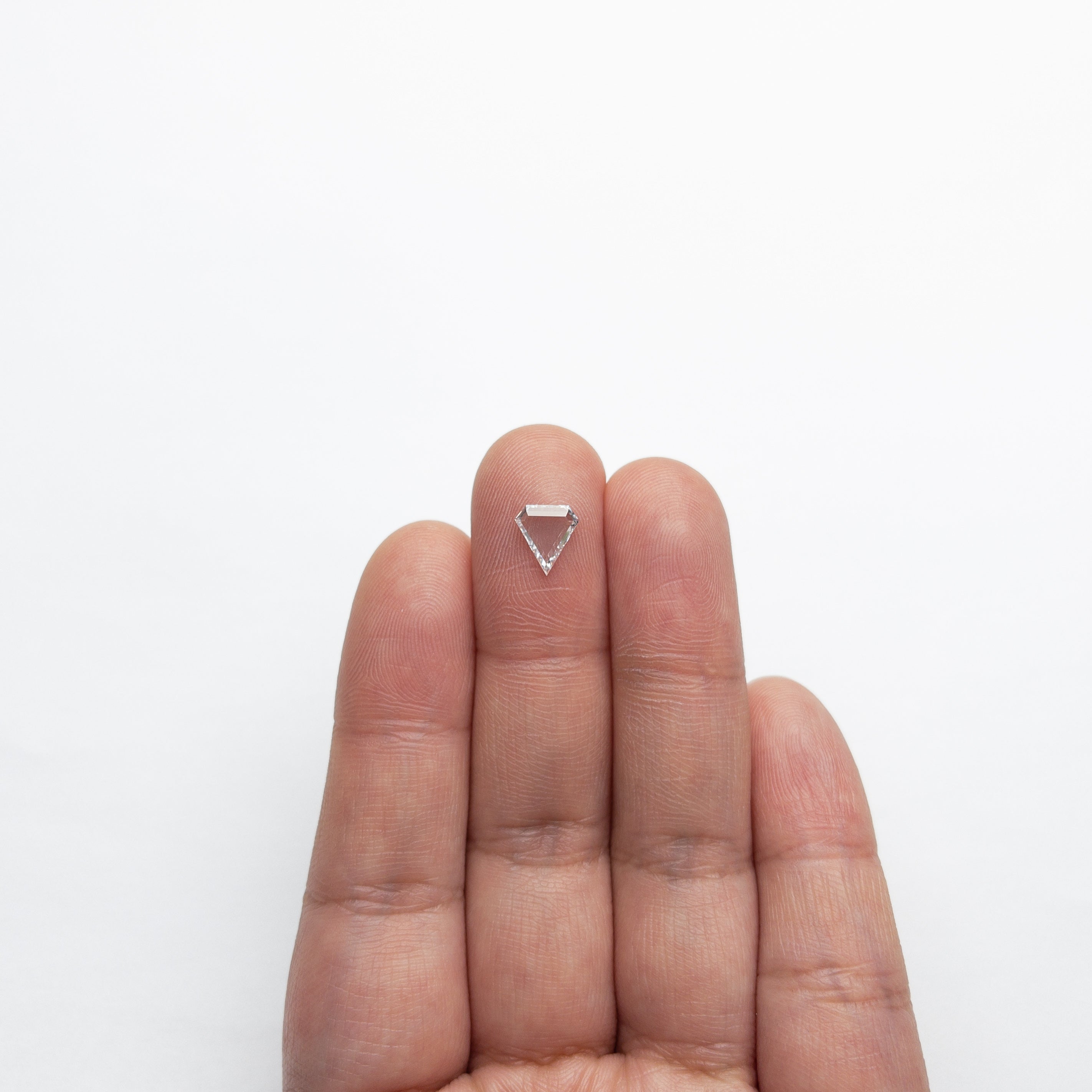 The 0.72ct 7.65x6.92x1.75mm VS2 D Shield Portrait Cut 19854-28 by East London jeweller Rachel Boston | Discover our collections of unique and timeless engagement rings, wedding rings, and modern fine jewellery.