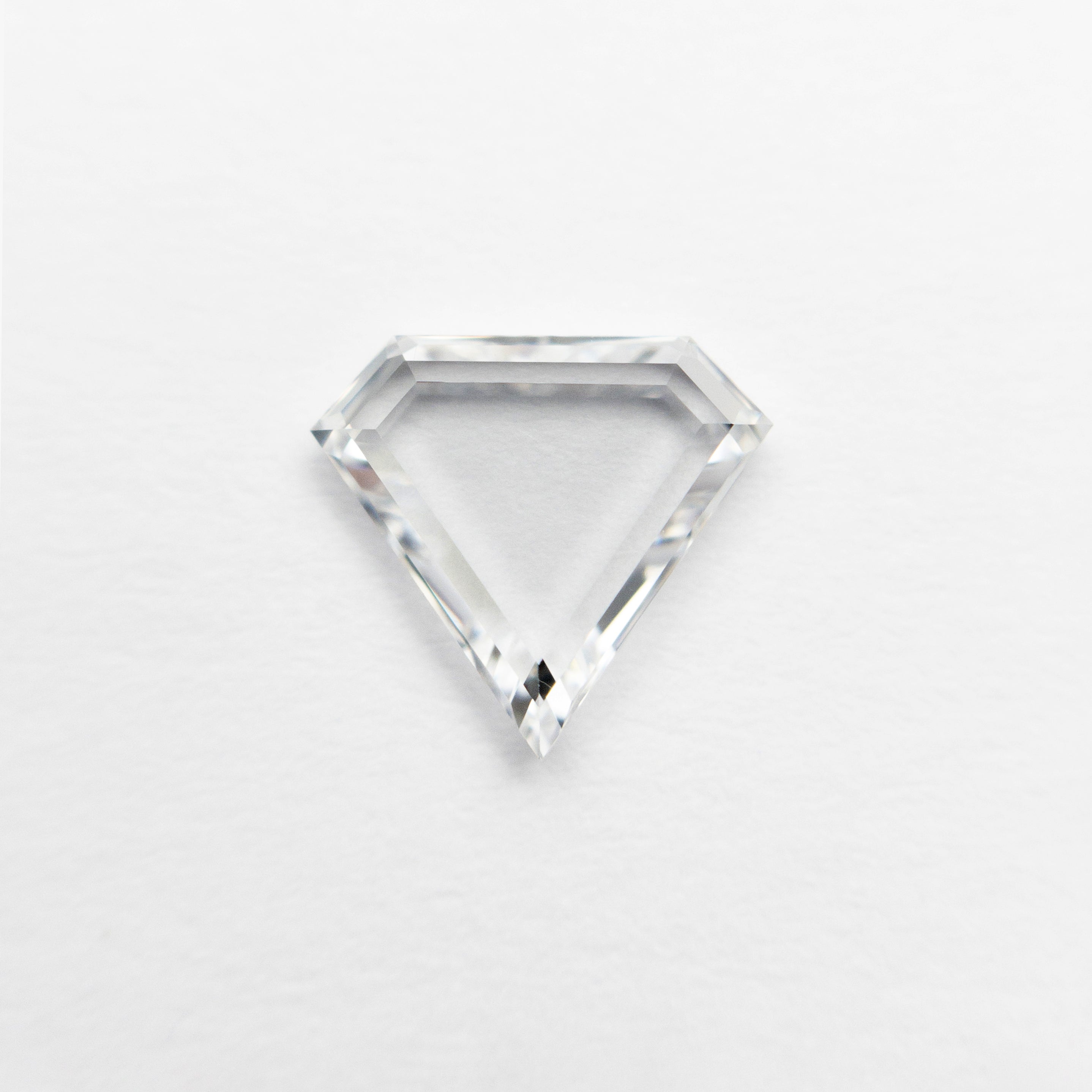 The 0.75ct 6.96x7.54x1.80mm VS1 E Shield Portrait Cut 19854-31 by East London jeweller Rachel Boston | Discover our collections of unique and timeless engagement rings, wedding rings, and modern fine jewellery.