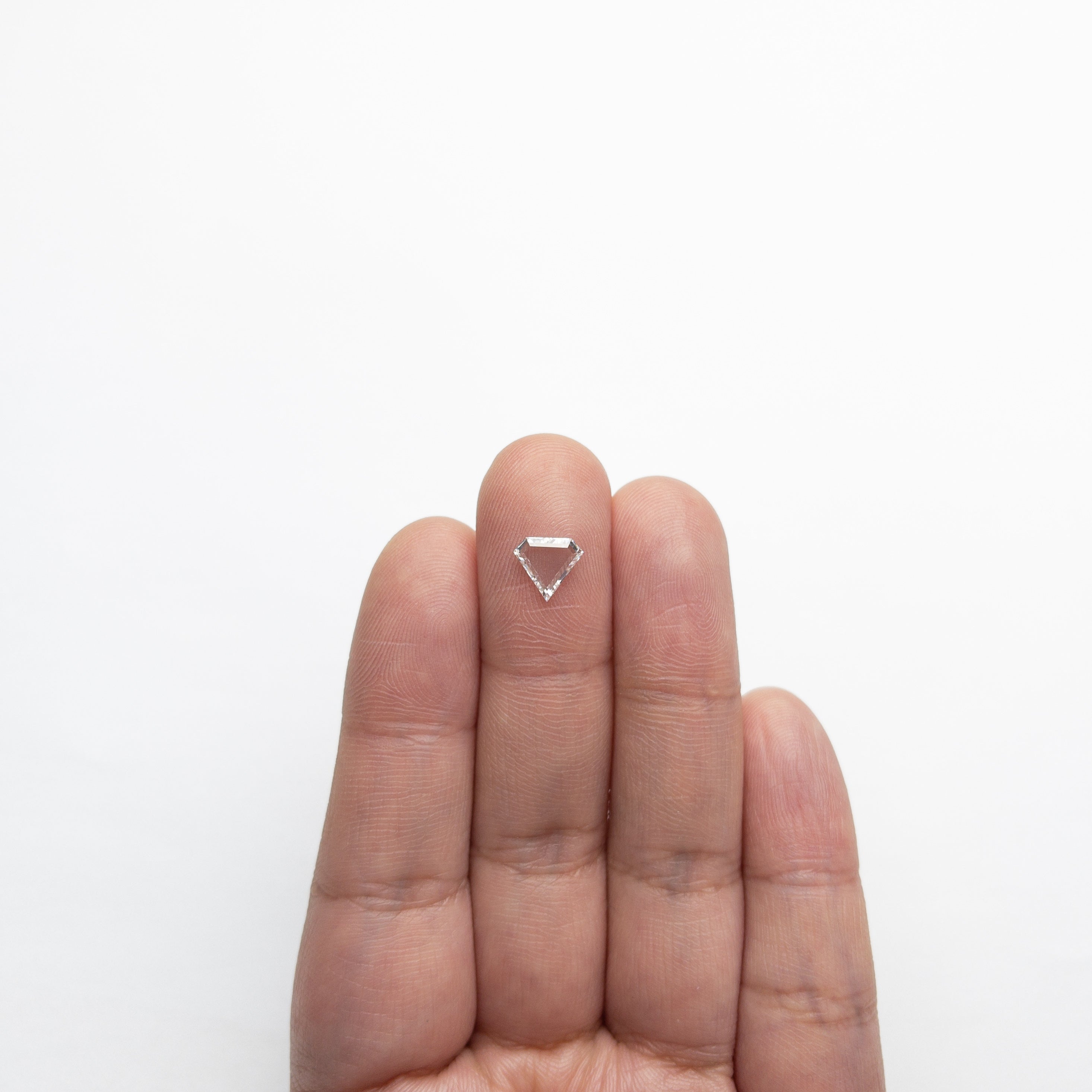 The 0.75ct 6.96x7.54x1.80mm VS1 E Shield Portrait Cut 19854-31 by East London jeweller Rachel Boston | Discover our collections of unique and timeless engagement rings, wedding rings, and modern fine jewellery.