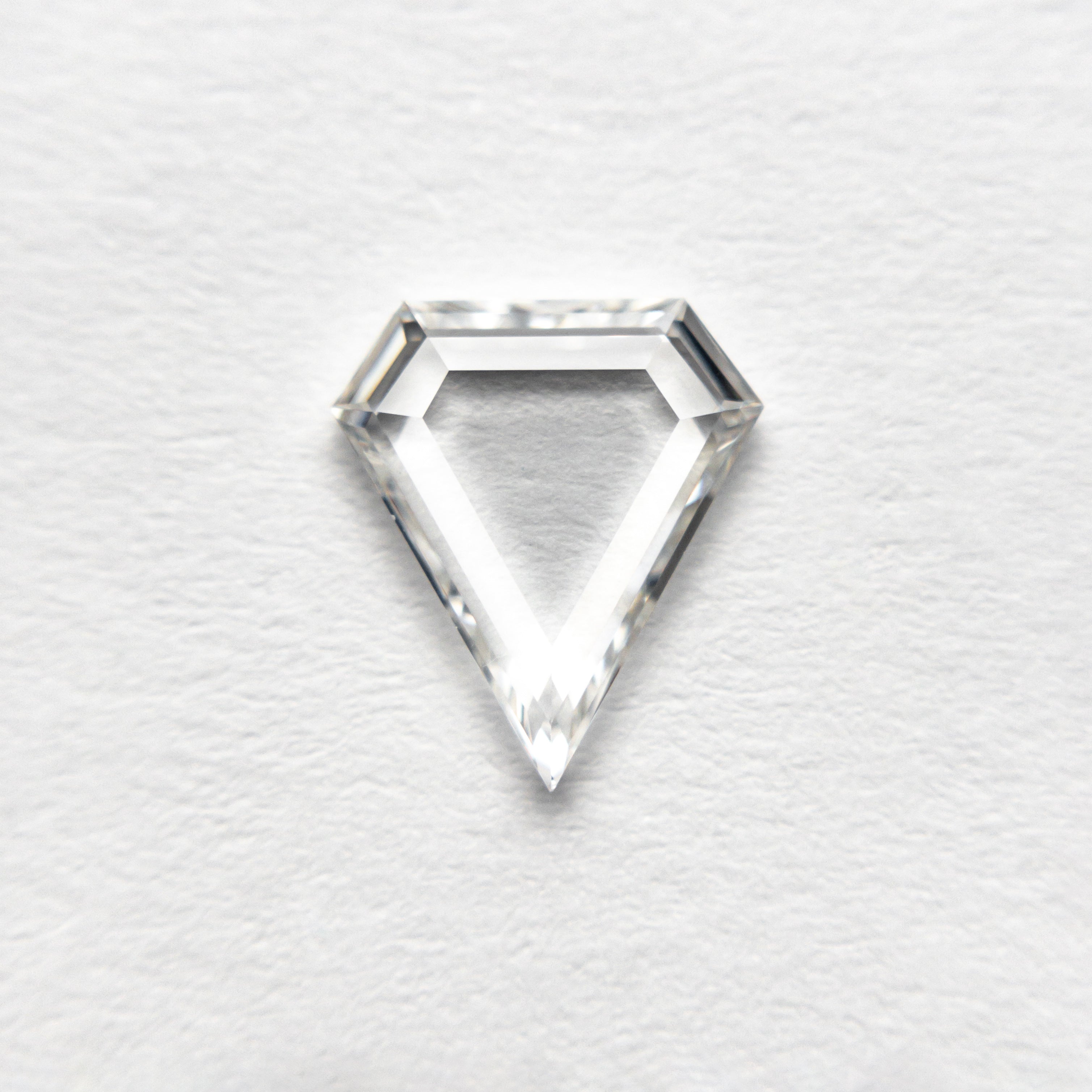 The 0.72ct 8.36x7.27x1.53mm VS2 F Shield Portrait Cut 19854-34 by East London jeweller Rachel Boston | Discover our collections of unique and timeless engagement rings, wedding rings, and modern fine jewellery.