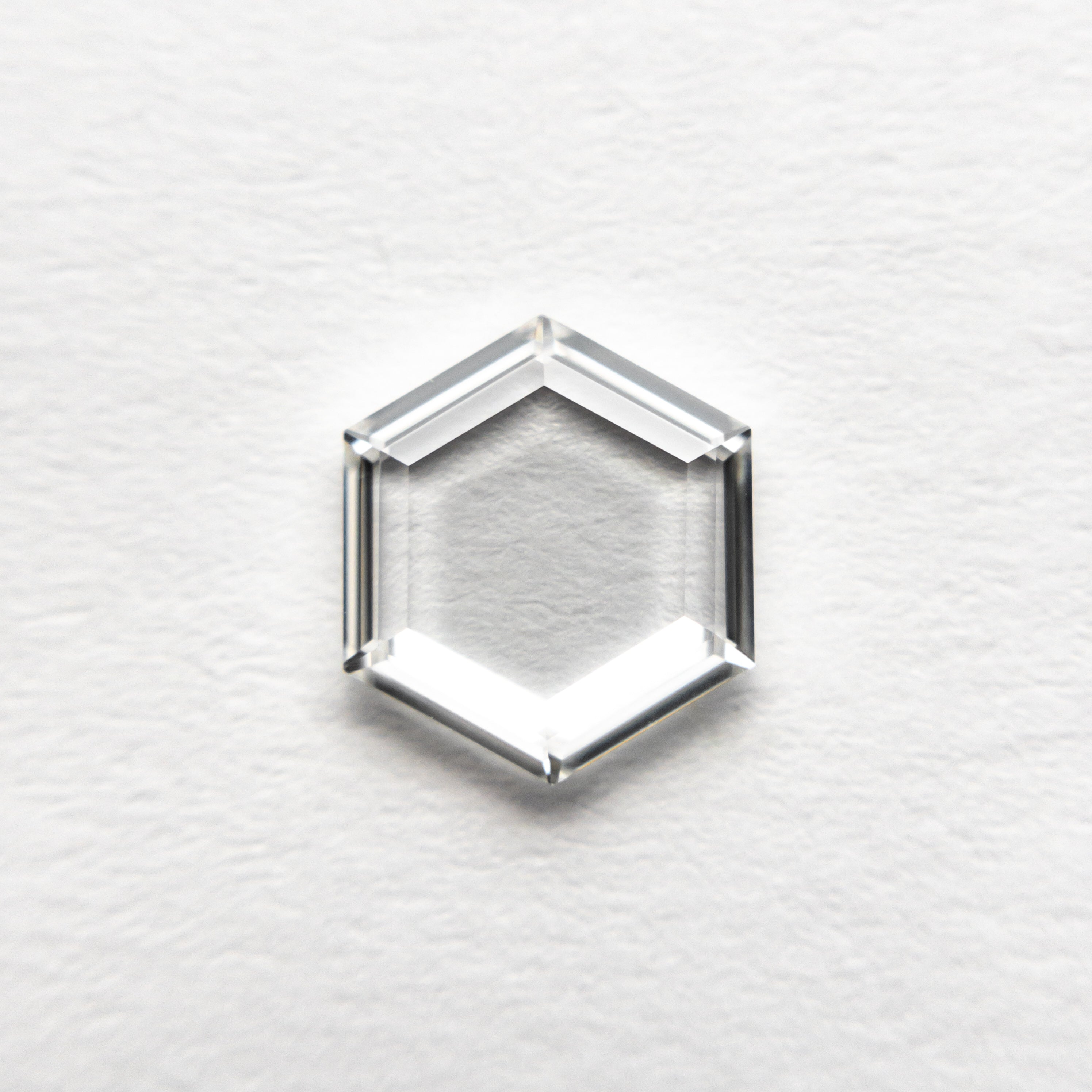 The 1.01ct 7.95x6.92x1.69mm VS2 G Hexagon Portrait Cut 19854-35 by East London jeweller Rachel Boston | Discover our collections of unique and timeless engagement rings, wedding rings, and modern fine jewellery.
