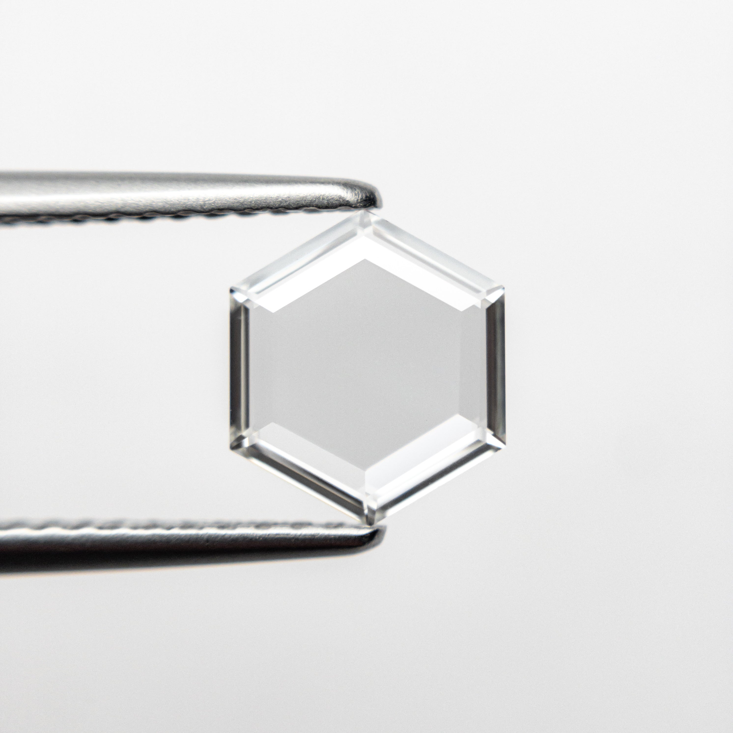 The 1.01ct 7.95x6.92x1.69mm VS2 G Hexagon Portrait Cut 19854-35 by East London jeweller Rachel Boston | Discover our collections of unique and timeless engagement rings, wedding rings, and modern fine jewellery.