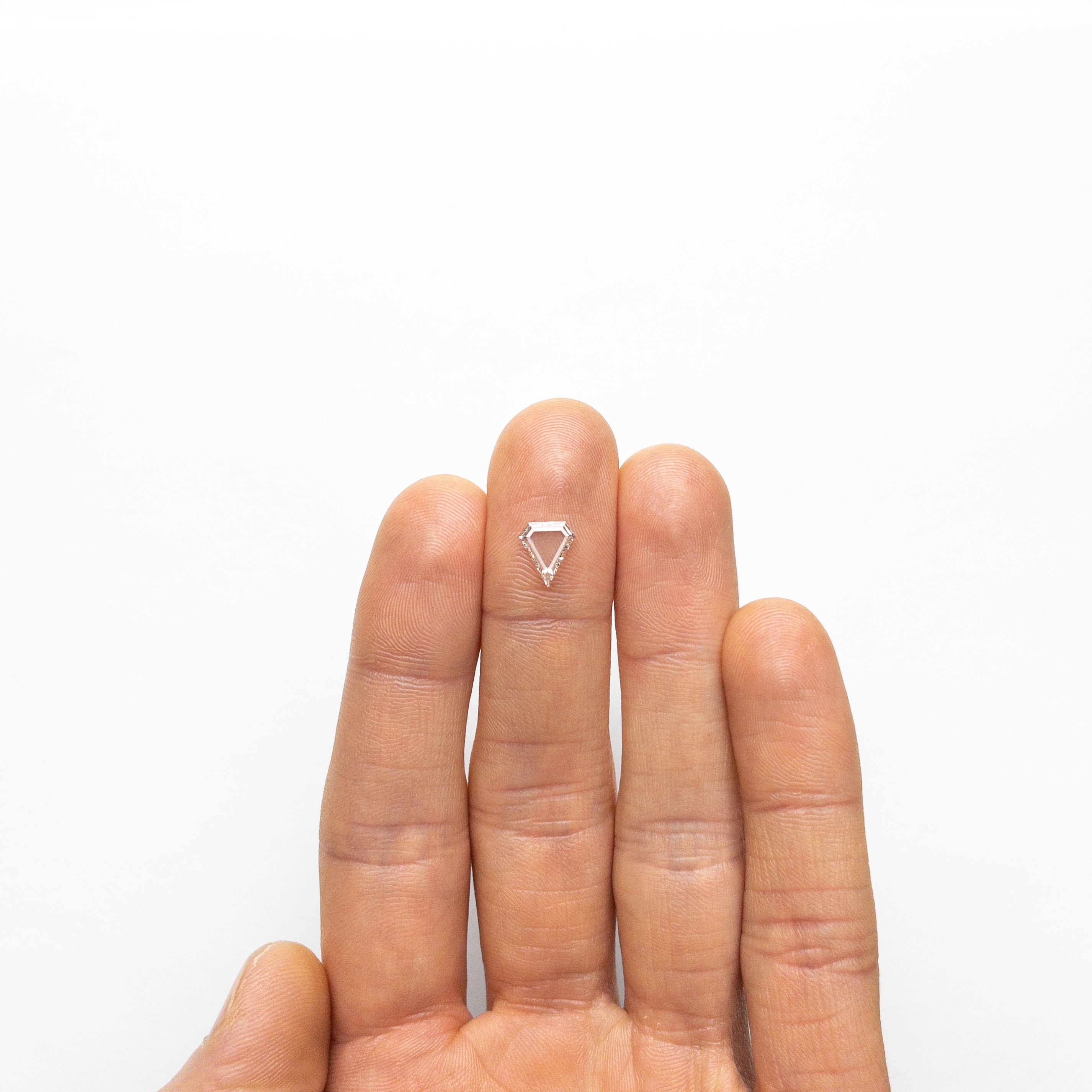 The 0.72ct 8.35x7.23x1.52mm SI1 H Shield Portrait Cut 19854-37 by East London jeweller Rachel Boston | Discover our collections of unique and timeless engagement rings, wedding rings, and modern fine jewellery.