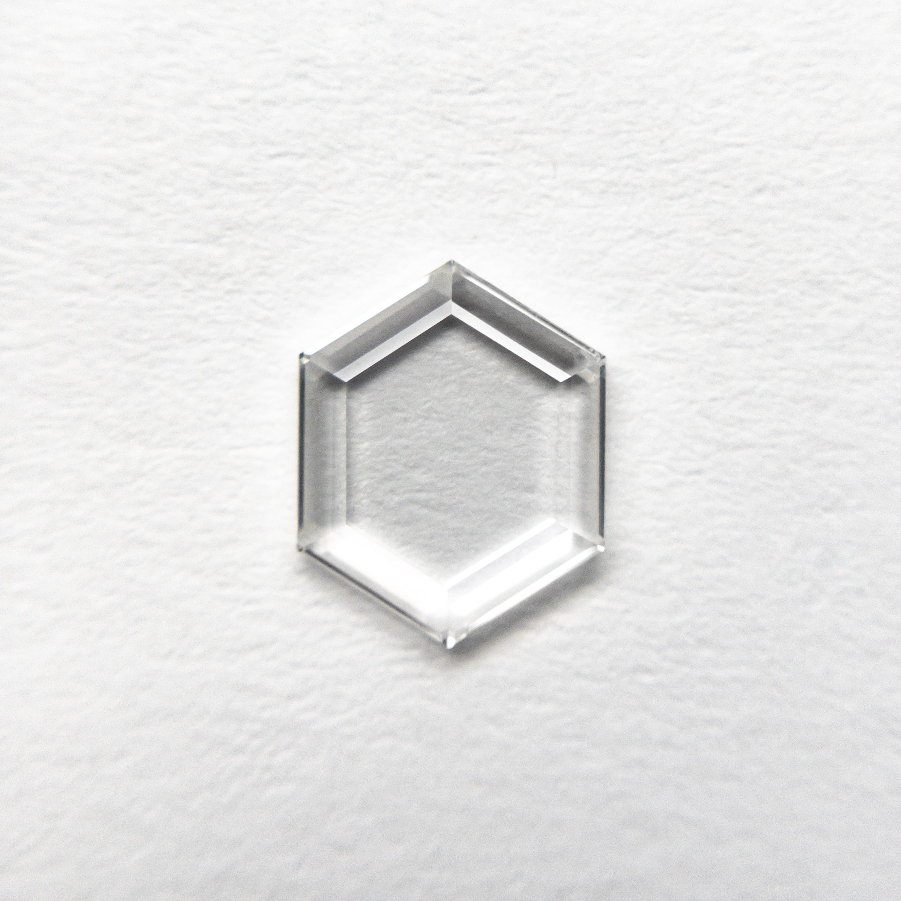 The 0.69ct 7.78x6.21x1.33mm VS2 G Hexagon Portrait Cut 19854-42 by East London jeweller Rachel Boston | Discover our collections of unique and timeless engagement rings, wedding rings, and modern fine jewellery.