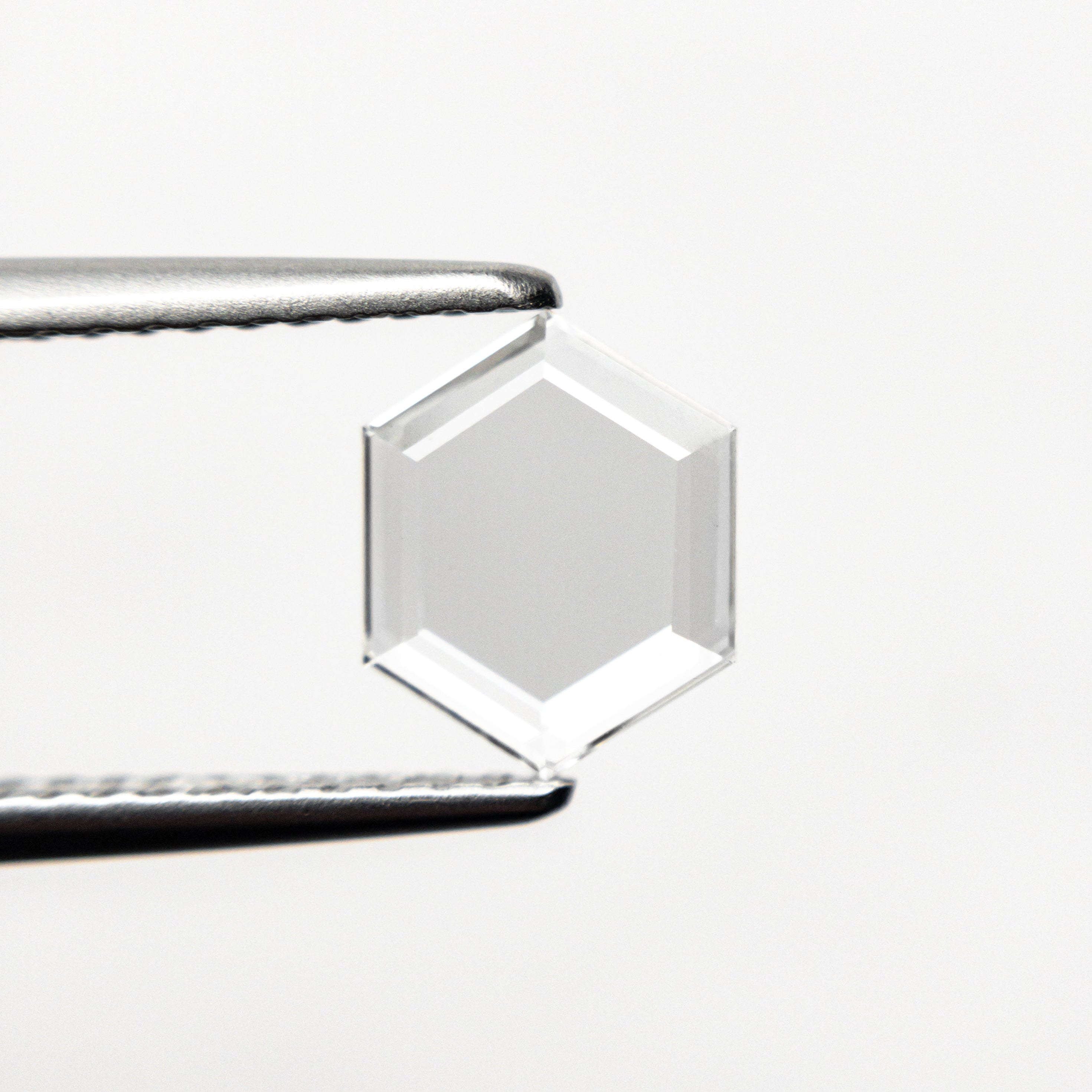 The 0.69ct 7.78x6.21x1.33mm VS2 G Hexagon Portrait Cut 19854-42 by East London jeweller Rachel Boston | Discover our collections of unique and timeless engagement rings, wedding rings, and modern fine jewellery.