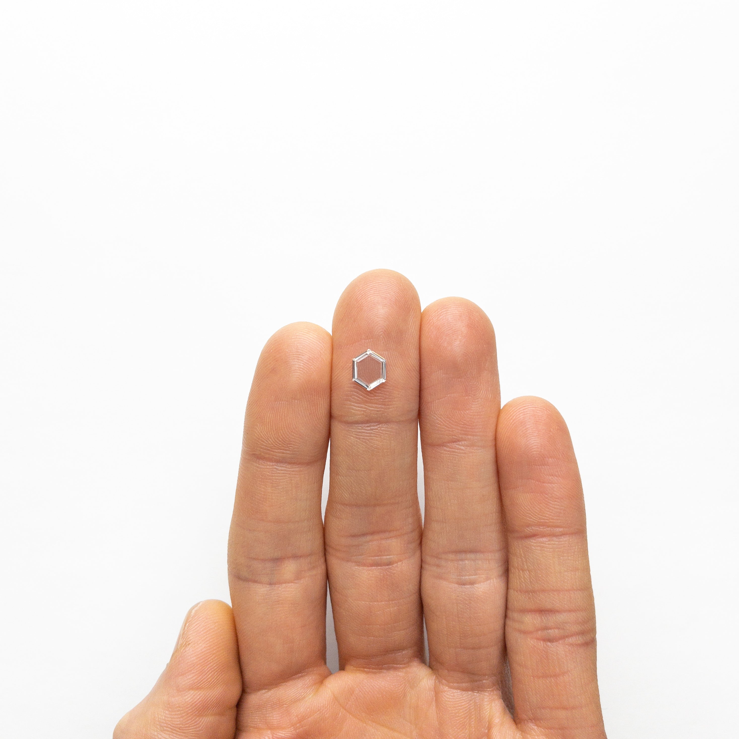 The 0.69ct 7.78x6.21x1.33mm VS2 G Hexagon Portrait Cut 19854-42 by East London jeweller Rachel Boston | Discover our collections of unique and timeless engagement rings, wedding rings, and modern fine jewellery.