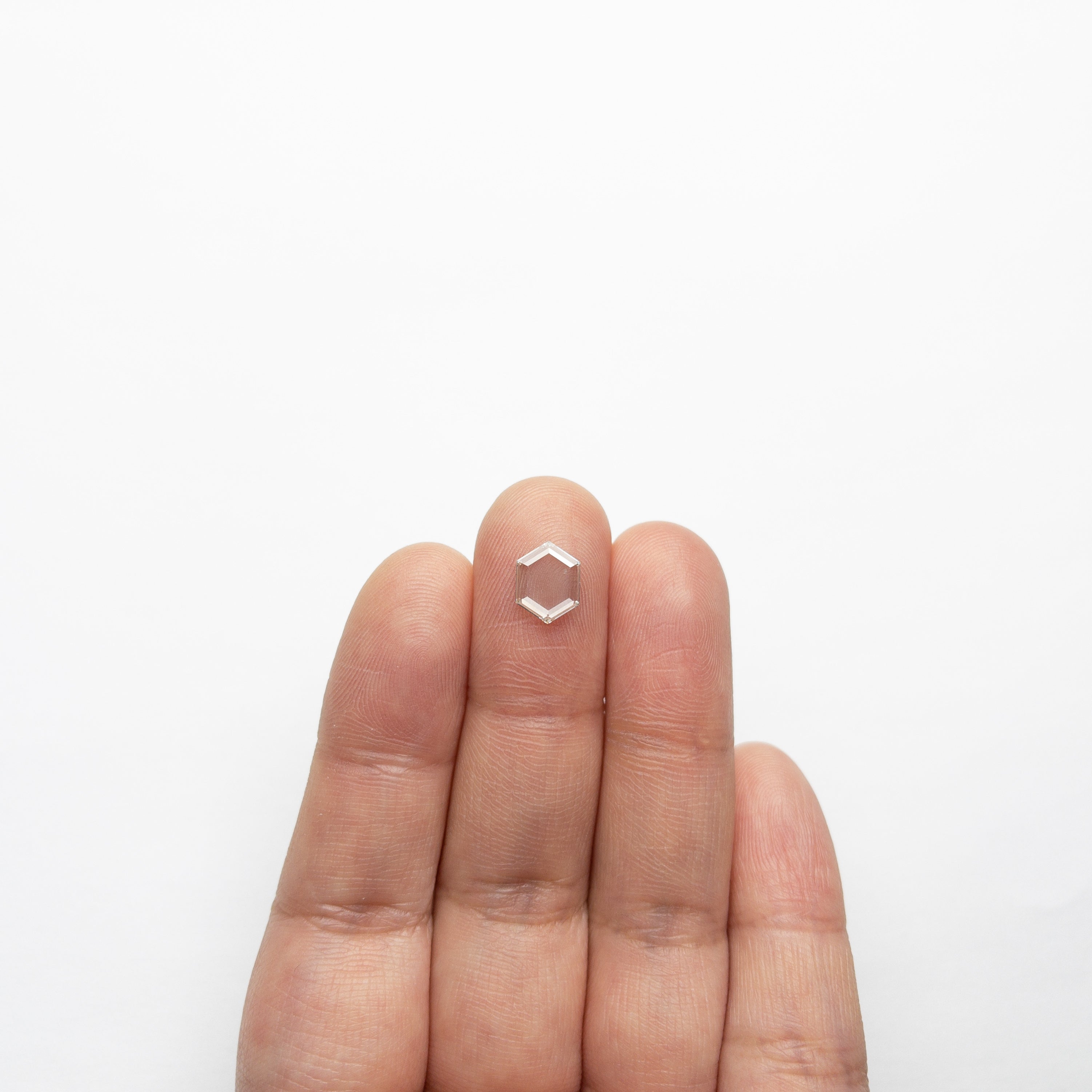 The 1.05ct 8.83x6.78x1.58mm SI2 I Hexagon Portrait Cut 19854-46 by East London jeweller Rachel Boston | Discover our collections of unique and timeless engagement rings, wedding rings, and modern fine jewellery.