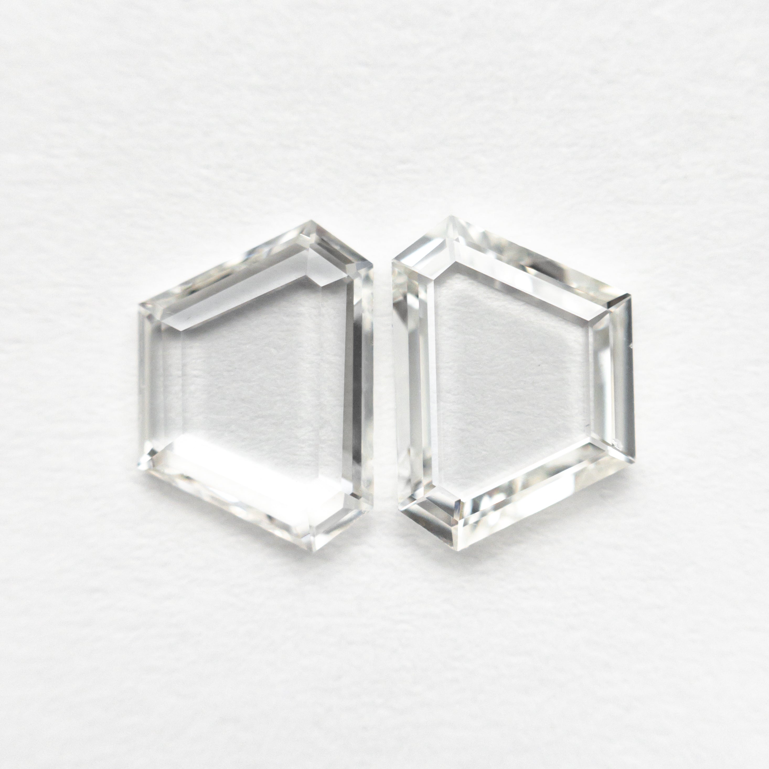 The 1.40cttw 2pc 7.87x5.60x1.54mm 7.90x5.63x1.42mm VS G-H Trapezoid Portrait Cut Matching Pair 19854-47 by East London jeweller Rachel Boston | Discover our collections of unique and timeless engagement rings, wedding rings, and modern fine jewellery.
