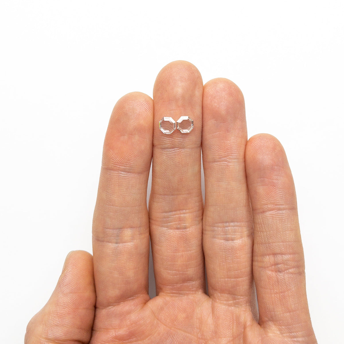 The 0.98cttw 2pc 5.46x5.46x1.38mm 5.49x5.44x1.46mm VVS G-I Octagon Portrait Cut Matching Pair 19854-51 by East London jeweller Rachel Boston | Discover our collections of unique and timeless engagement rings, wedding rings, and modern fine jewellery.
