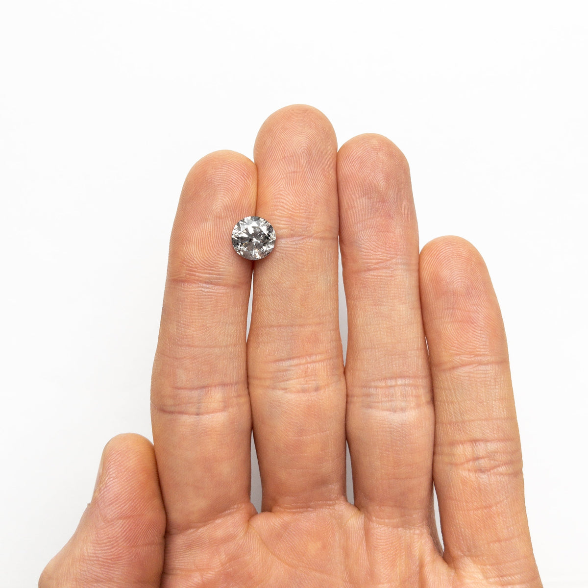 The 2.45ct 8.42x8.31x5.34mm Round Brilliant 19914-02 by East London jeweller Rachel Boston | Discover our collections of unique and timeless engagement rings, wedding rings, and modern fine jewellery.