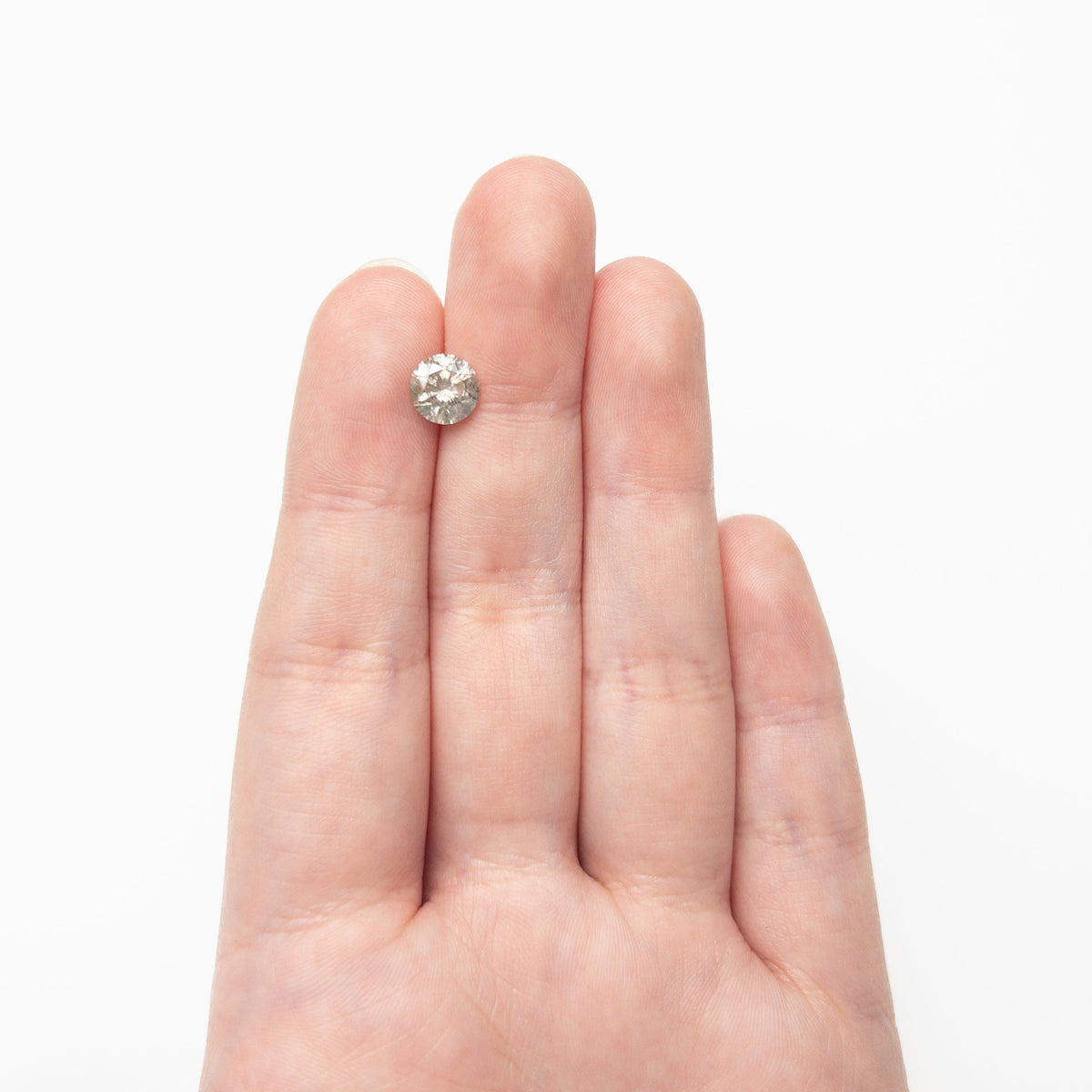 The 1.58ct 7.20x7.19x4.75mm Round Brilliant 20024-01 by East London jeweller Rachel Boston | Discover our collections of unique and timeless engagement rings, wedding rings, and modern fine jewellery.