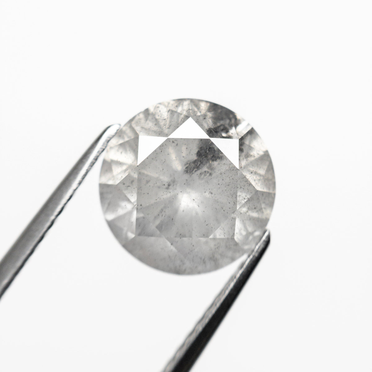 The 3.31ct 9.21x9.19x6.01mm Round Brilliant 20025-05 by East London jeweller Rachel Boston | Discover our collections of unique and timeless engagement rings, wedding rings, and modern fine jewellery.