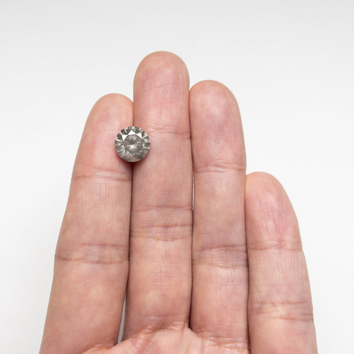 The 3.13ct 9.23x9.21x5.78mm Round Brilliant 20025-08 by East London jeweller Rachel Boston | Discover our collections of unique and timeless engagement rings, wedding rings, and modern fine jewellery.