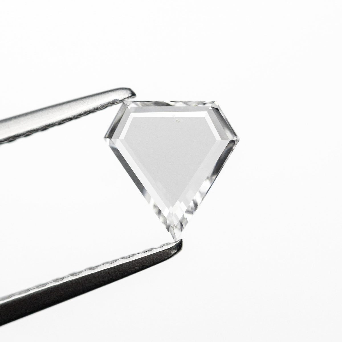 The 0.49ct 6.60x6.46x1.44mm Shield Portrait Cut 20027-11 by East London jeweller Rachel Boston | Discover our collections of unique and timeless engagement rings, wedding rings, and modern fine jewellery.