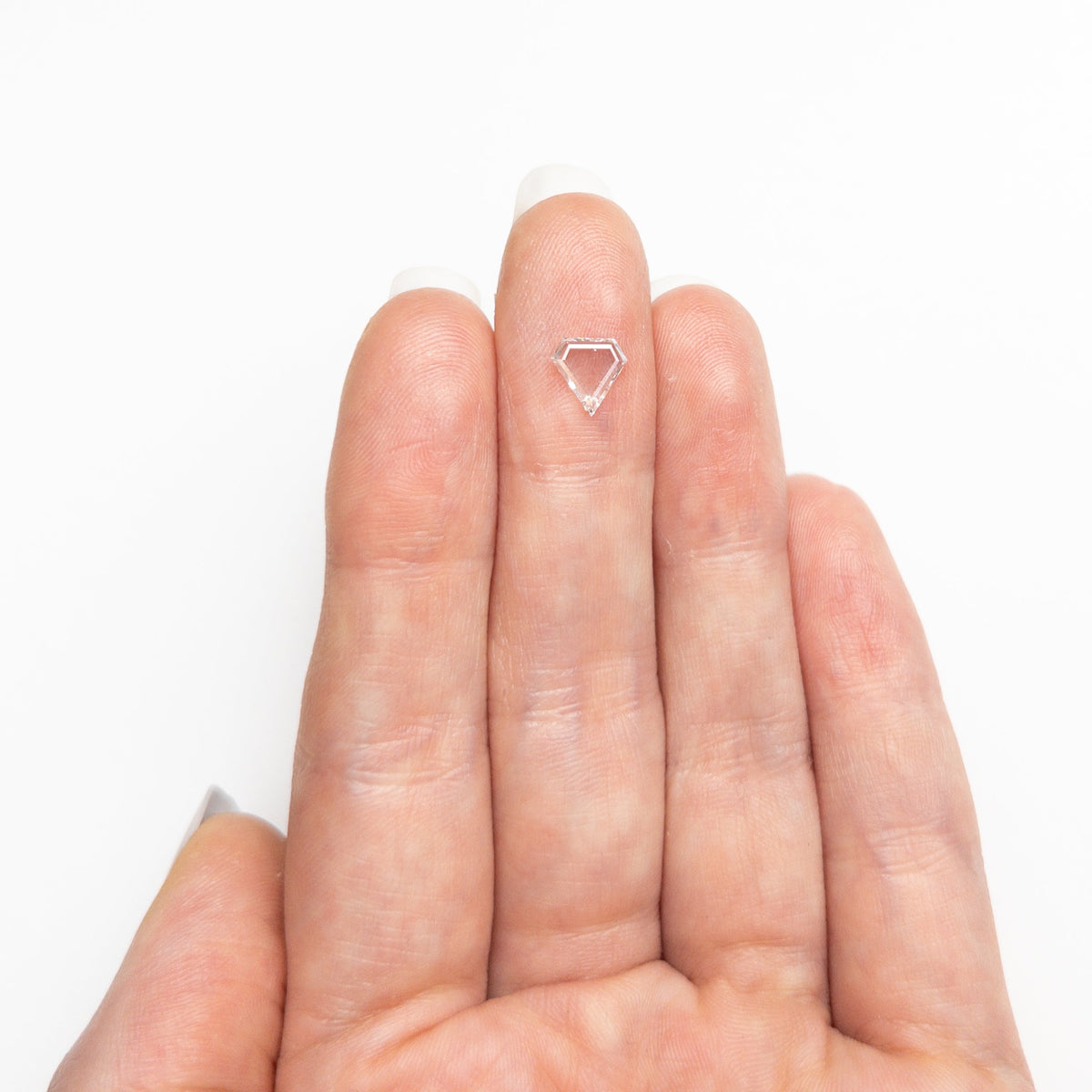 The 0.49ct 6.60x6.46x1.44mm Shield Portrait Cut 20027-11 by East London jeweller Rachel Boston | Discover our collections of unique and timeless engagement rings, wedding rings, and modern fine jewellery.
