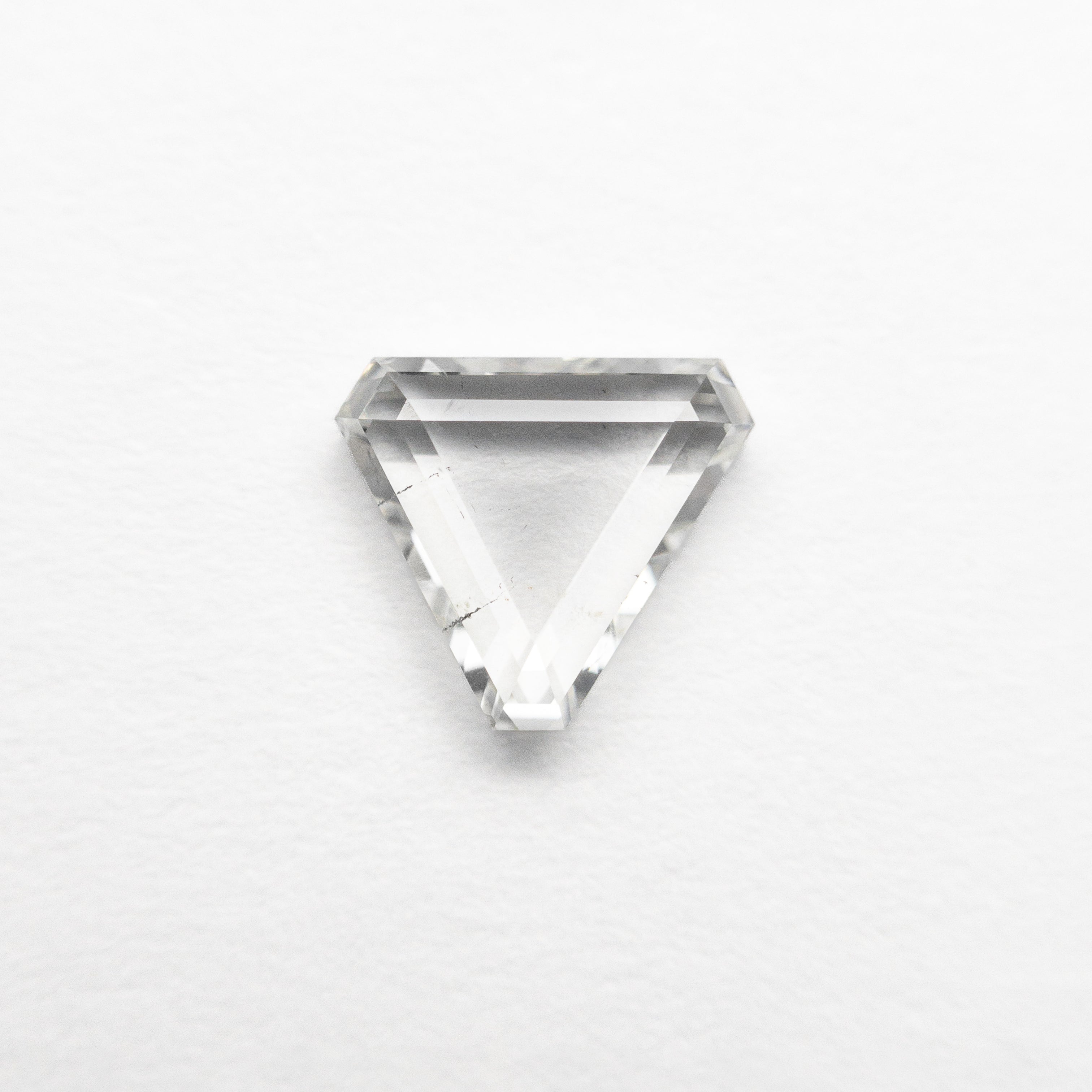 The 0.69ct 5.67x6.35x2.04mm Cut Corner Triangle Portrait Cut 20027-14 by East London jeweller Rachel Boston | Discover our collections of unique and timeless engagement rings, wedding rings, and modern fine jewellery.