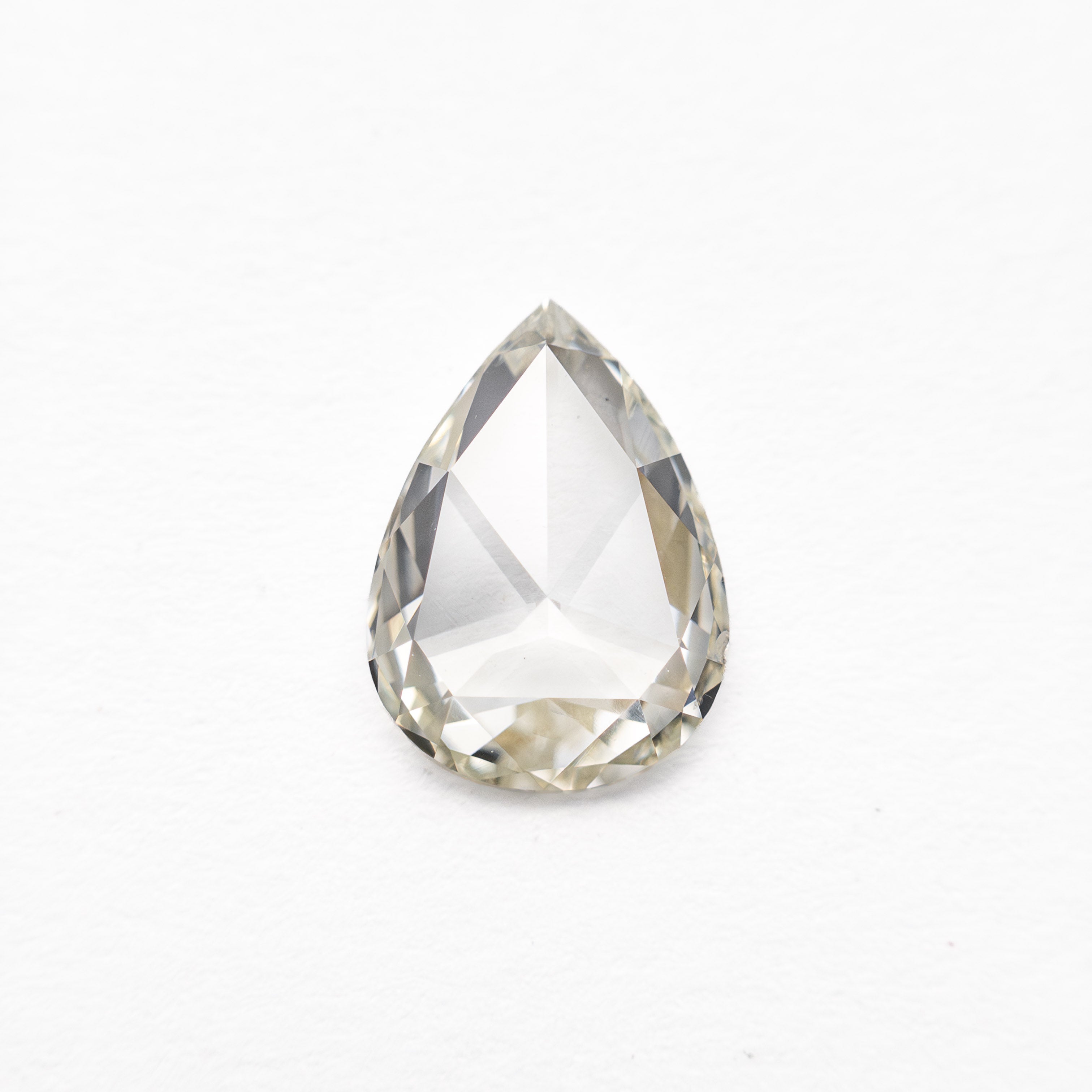 The 0.68ct 7.66x5.56x1.74mm SI1 L Pear Rosecut 20027-20 by East London jeweller Rachel Boston | Discover our collections of unique and timeless engagement rings, wedding rings, and modern fine jewellery.