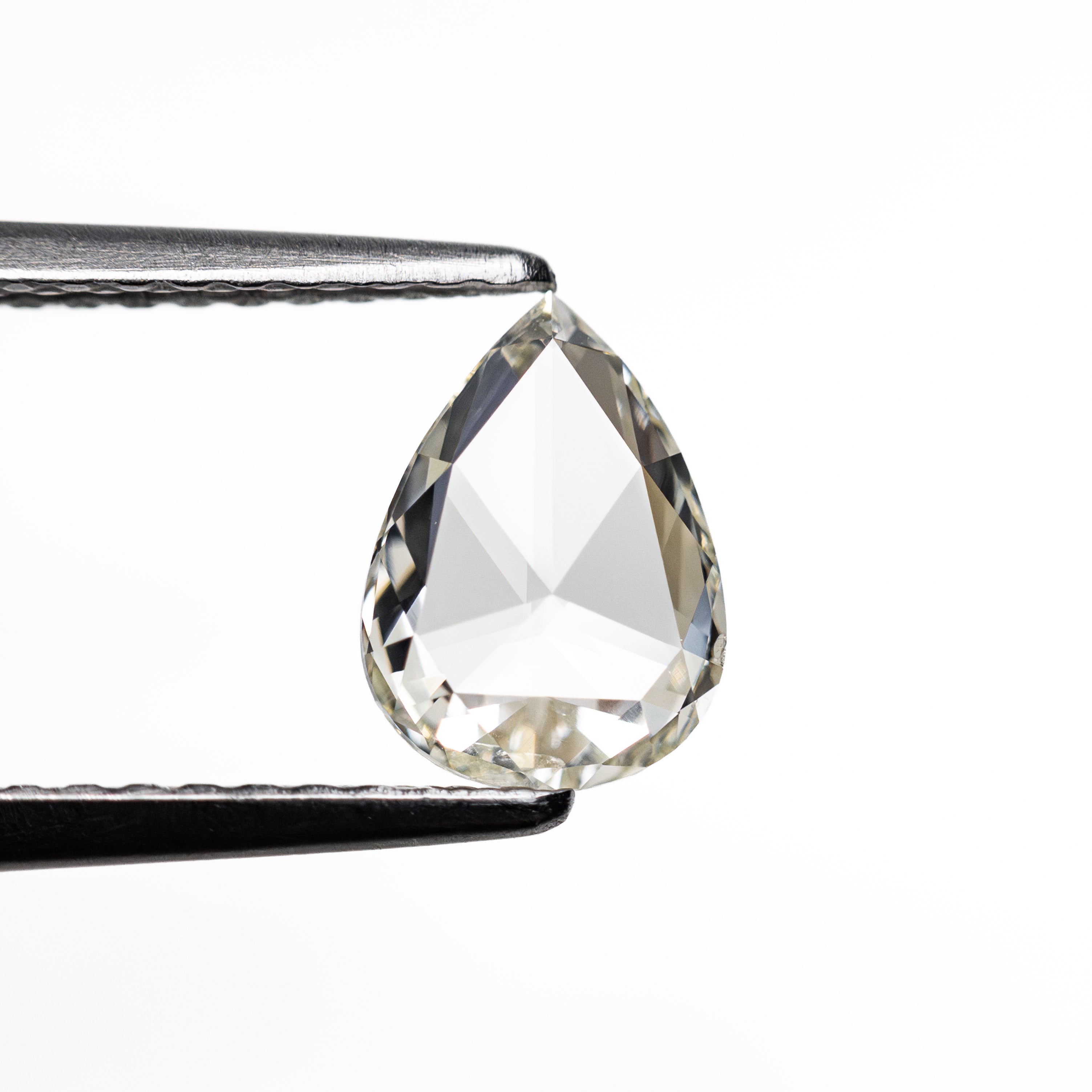 The 0.68ct 7.66x5.56x1.74mm SI1 L Pear Rosecut 20027-20 by East London jeweller Rachel Boston | Discover our collections of unique and timeless engagement rings, wedding rings, and modern fine jewellery.