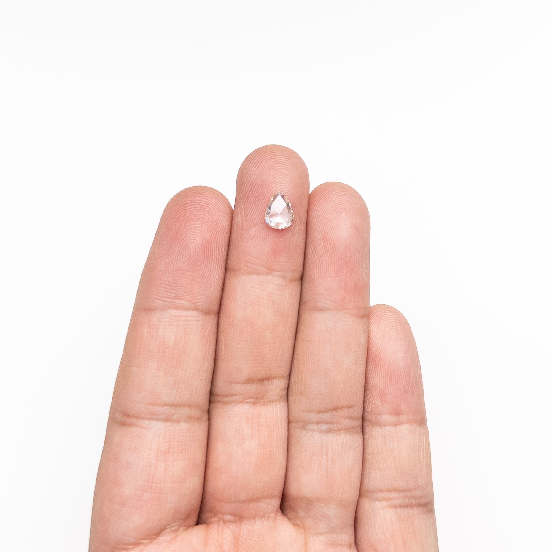 The 0.68ct 7.66x5.56x1.74mm SI1 L Pear Rosecut 20027-20 by East London jeweller Rachel Boston | Discover our collections of unique and timeless engagement rings, wedding rings, and modern fine jewellery.