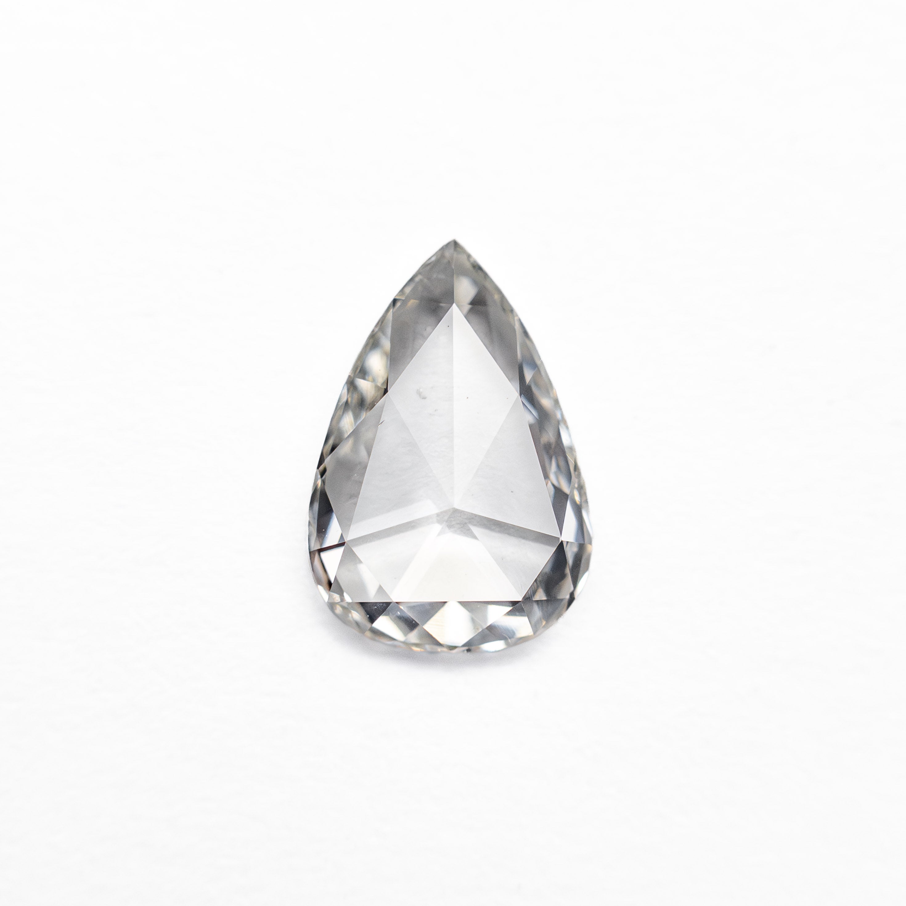 The 0.59ct 7.62x5.19x1.78mm SI2 G Pear Rosecut 20027-21 by East London jeweller Rachel Boston | Discover our collections of unique and timeless engagement rings, wedding rings, and modern fine jewellery.