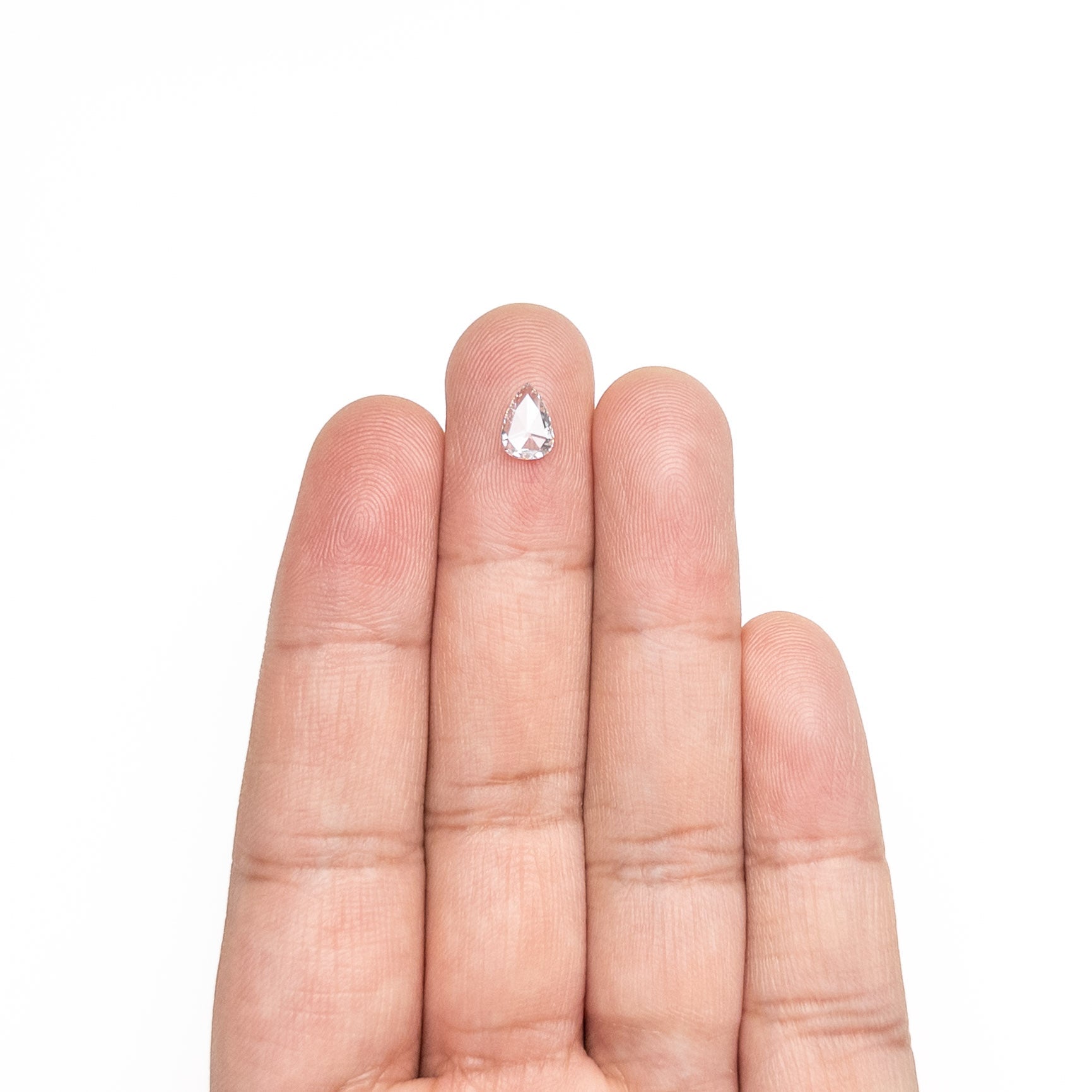 The 0.59ct 7.62x5.19x1.78mm SI2 G Pear Rosecut 20027-21 by East London jeweller Rachel Boston | Discover our collections of unique and timeless engagement rings, wedding rings, and modern fine jewellery.