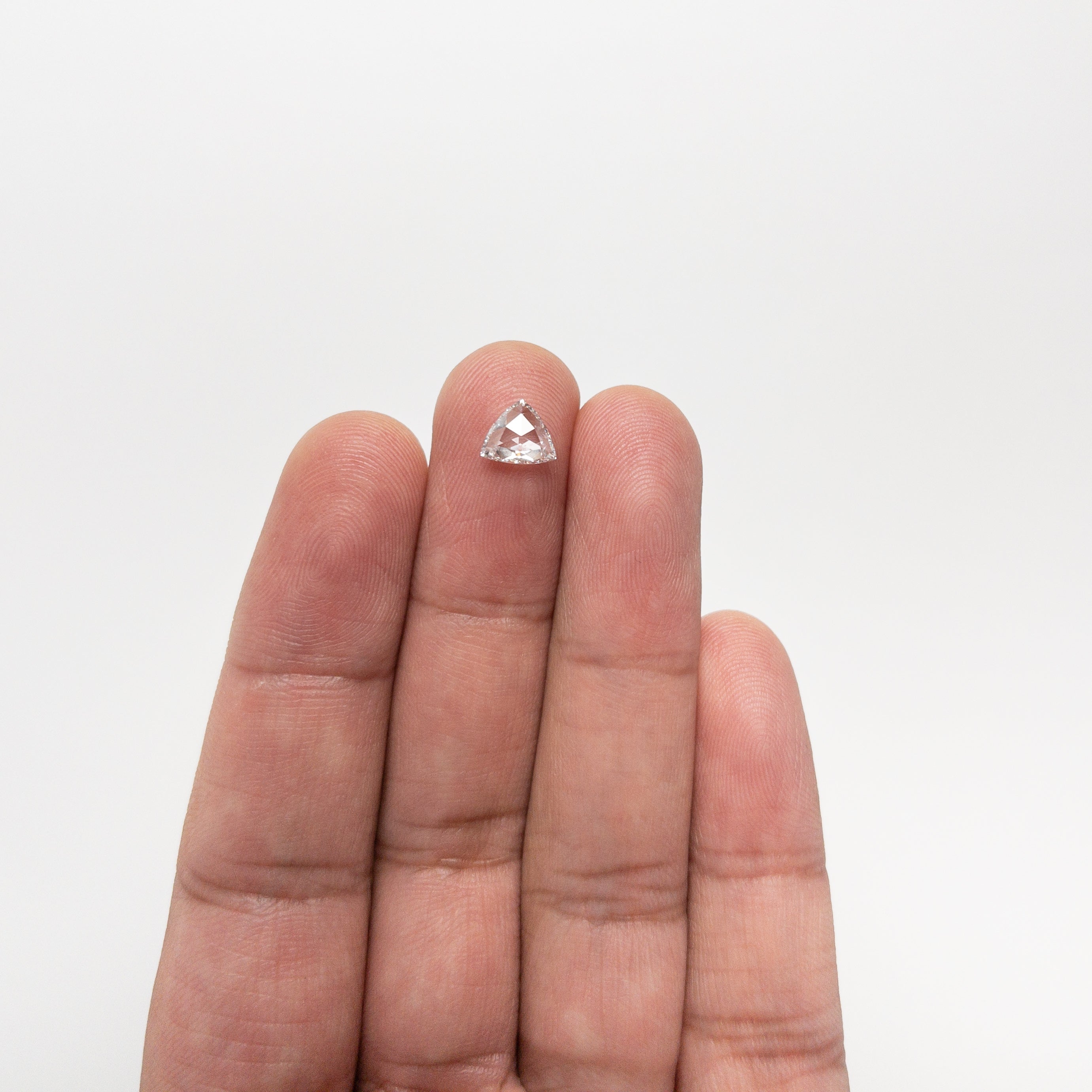 The 0.72ct 6.21x7.16x2.16mm VS2 D Trillion Rosecut 🇨🇦 21157-01 by East London jeweller Rachel Boston | Discover our collections of unique and timeless engagement rings, wedding rings, and modern fine jewellery.