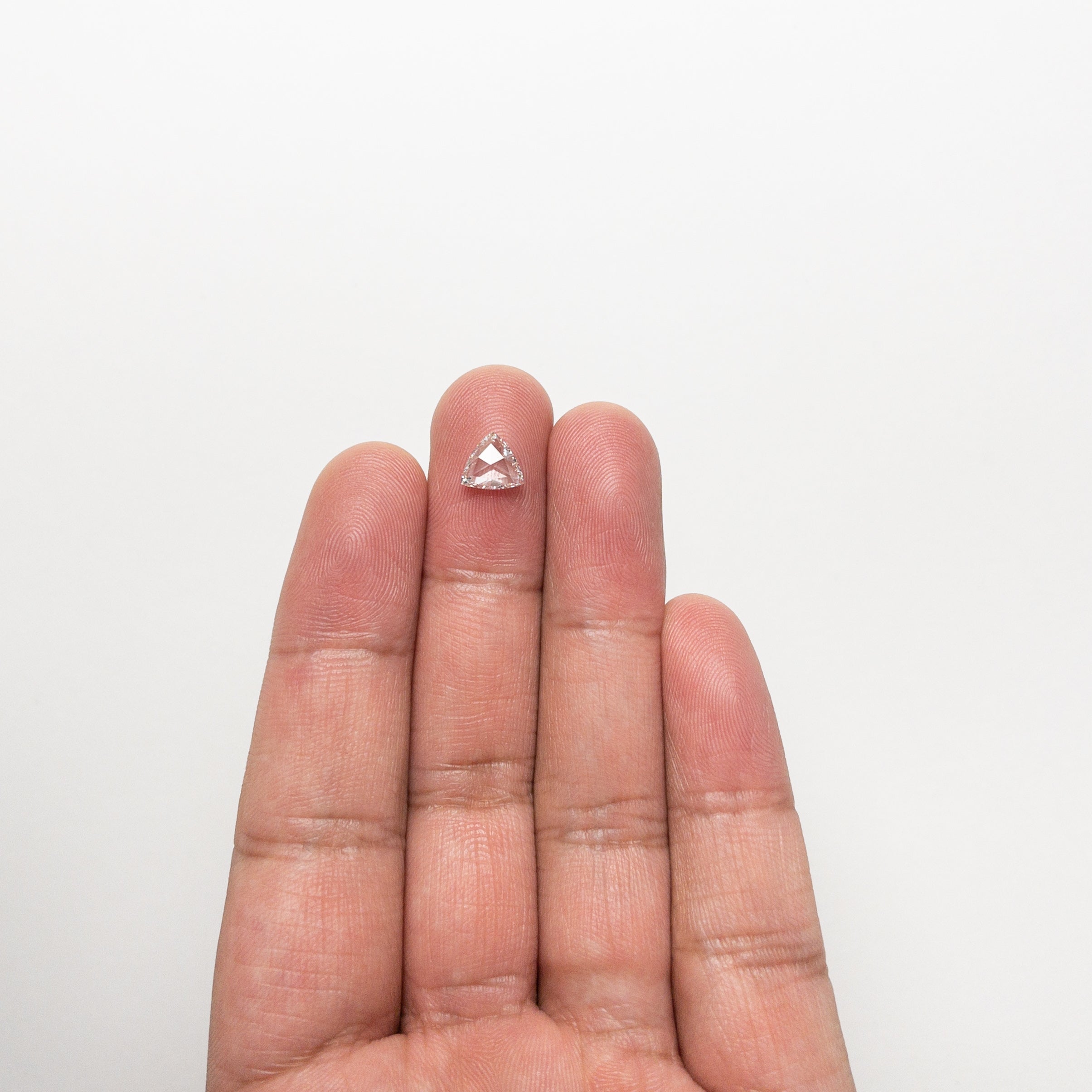The 0.72ct 6.68x7.38x1.96mm SI1 F Trillion Rosecut 🇨🇦 21300-01 by East London jeweller Rachel Boston | Discover our collections of unique and timeless engagement rings, wedding rings, and modern fine jewellery.