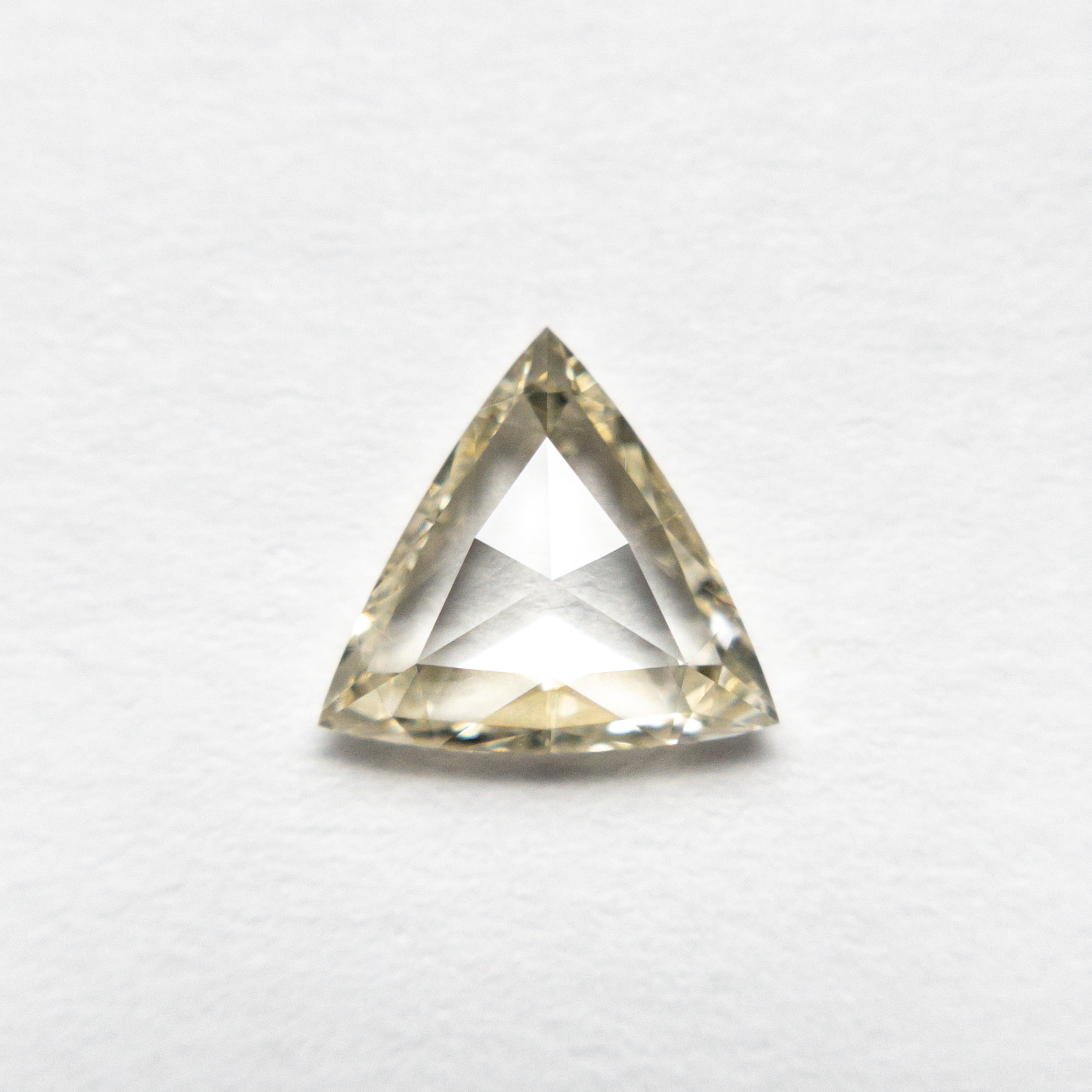 The 0.72ct 6.94x7.43x2.07mm VS1 Q-R Trillion Rosecut 🇨🇦 21310-01 by East London jeweller Rachel Boston | Discover our collections of unique and timeless engagement rings, wedding rings, and modern fine jewellery.