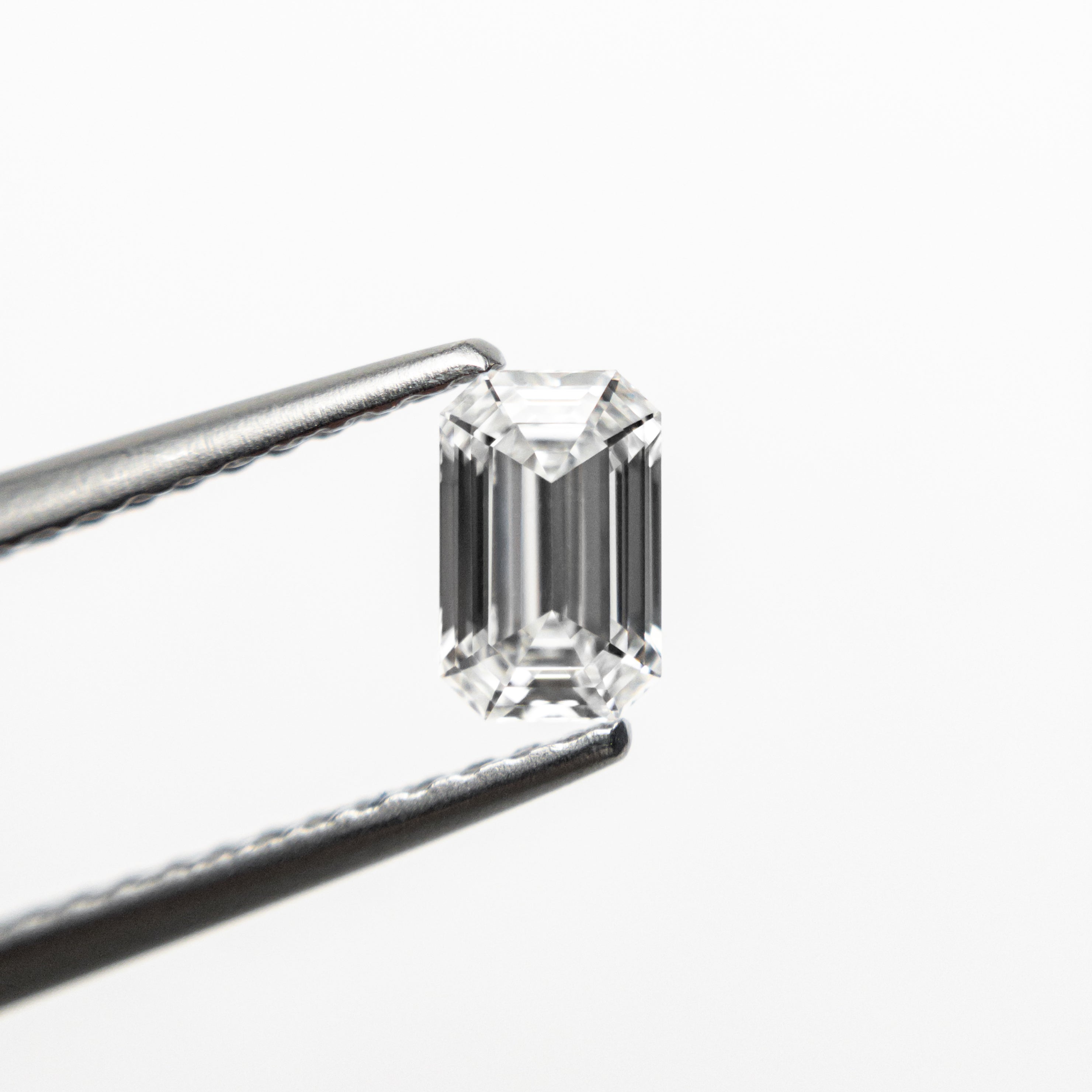 The 0.50ct 5.70x3.62x2.35mm VVS2 E Cut Corner Rectangle Step Cut 🇨🇦 21311-01 by East London jeweller Rachel Boston | Discover our collections of unique and timeless engagement rings, wedding rings, and modern fine jewellery.