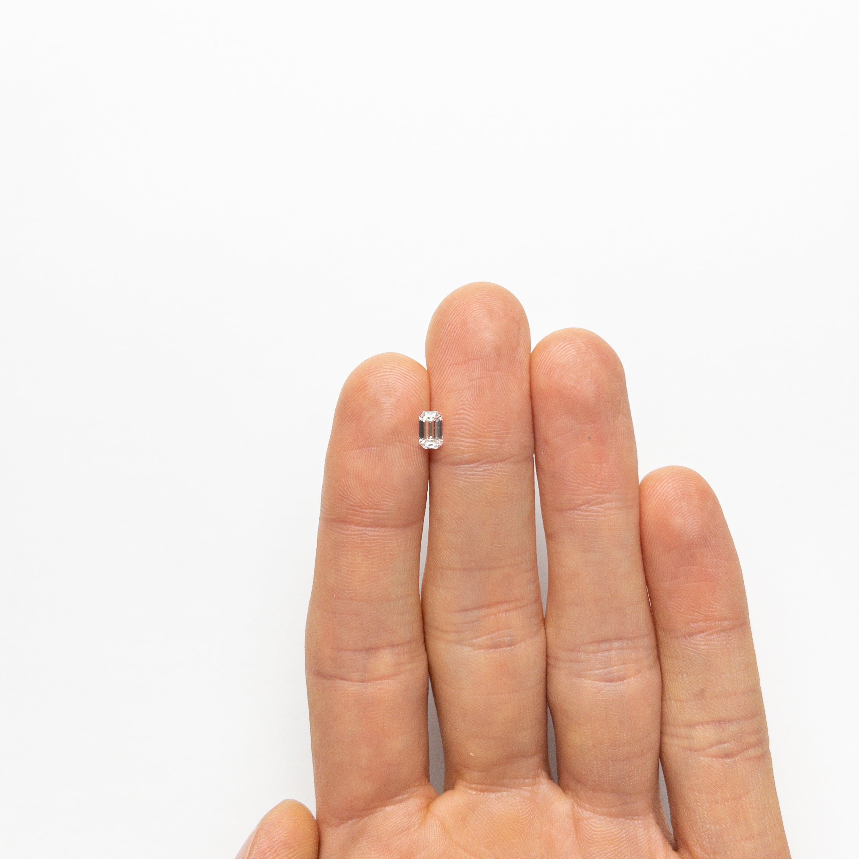 The 0.50ct 5.70x3.62x2.35mm VVS2 E Cut Corner Rectangle Step Cut 🇨🇦 21311-01 by East London jeweller Rachel Boston | Discover our collections of unique and timeless engagement rings, wedding rings, and modern fine jewellery.