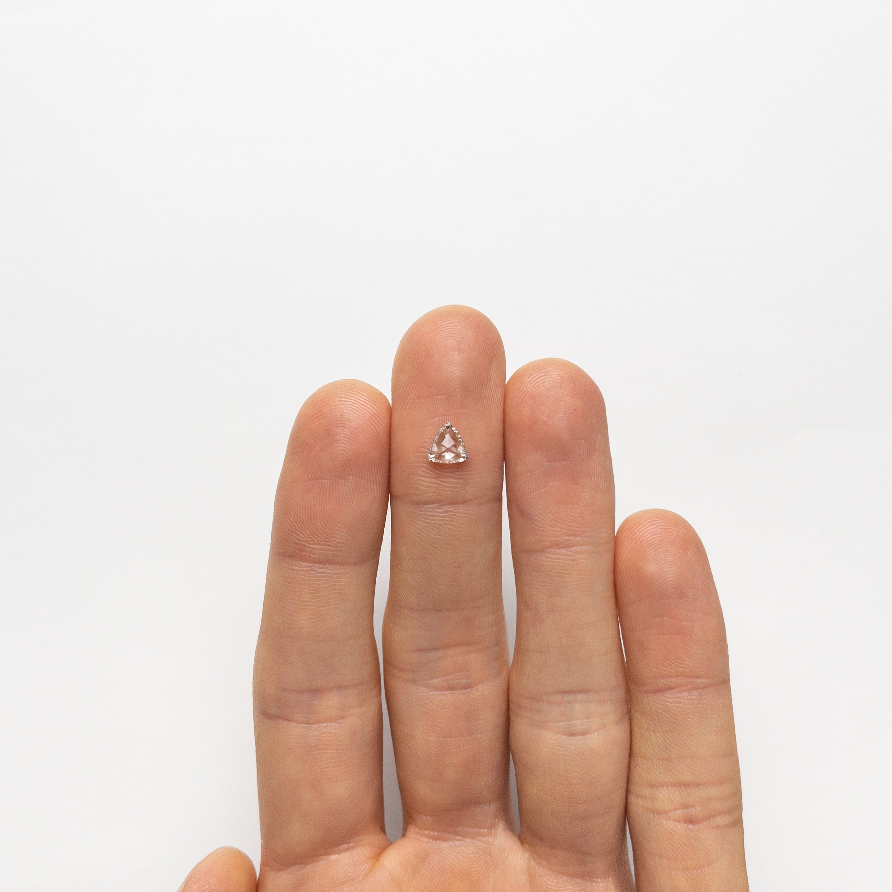 The 0.61ct 6.00x5.87x2.44mm VS2 L Trillion Rosecut 🇨🇦 21319-01 by East London jeweller Rachel Boston | Discover our collections of unique and timeless engagement rings, wedding rings, and modern fine jewellery.